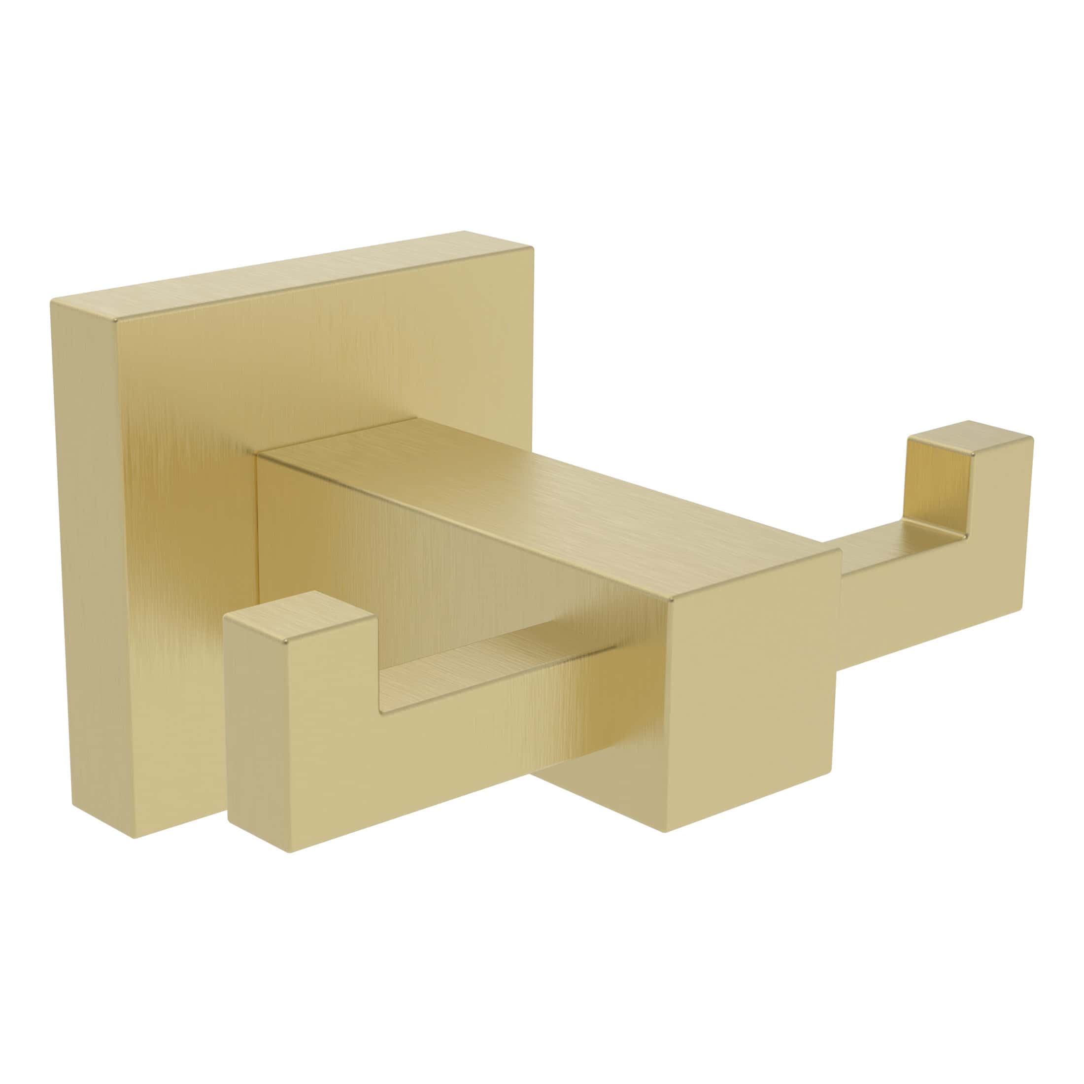 Sleek brass bathroom toilet paper holder with modern geometric design for contemporary bathroom decor.
