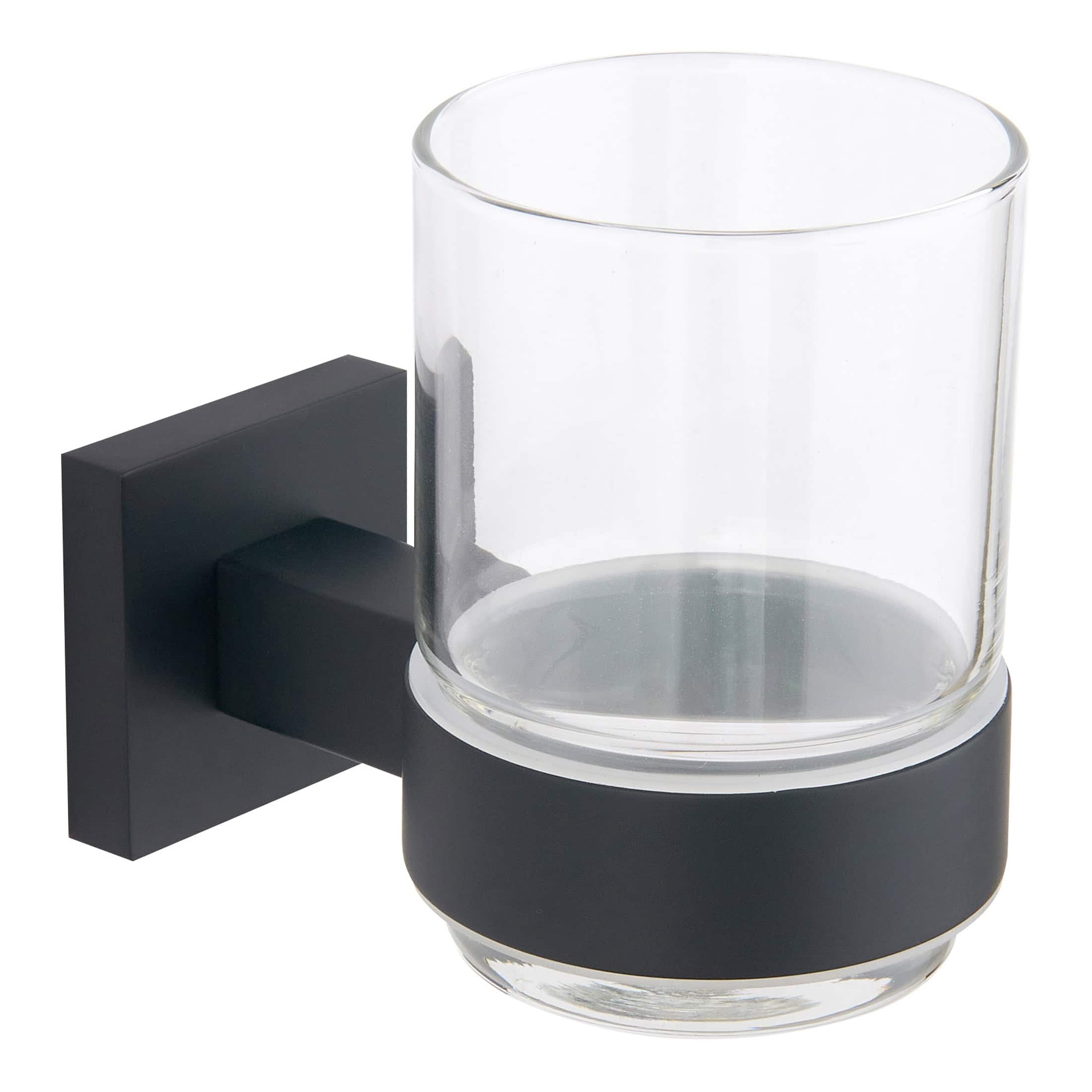 Sleek glass tumbler holder with black wall mount for bathroom or vanity use. Perfect for storing toothbrushes, toothpaste, or bathroom essentials, combining modern style with functionality.