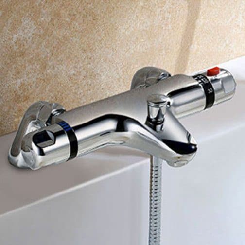 Chrome bathroom tap with temperature control and handheld shower attachment, ideal for modern bathroom renovations.