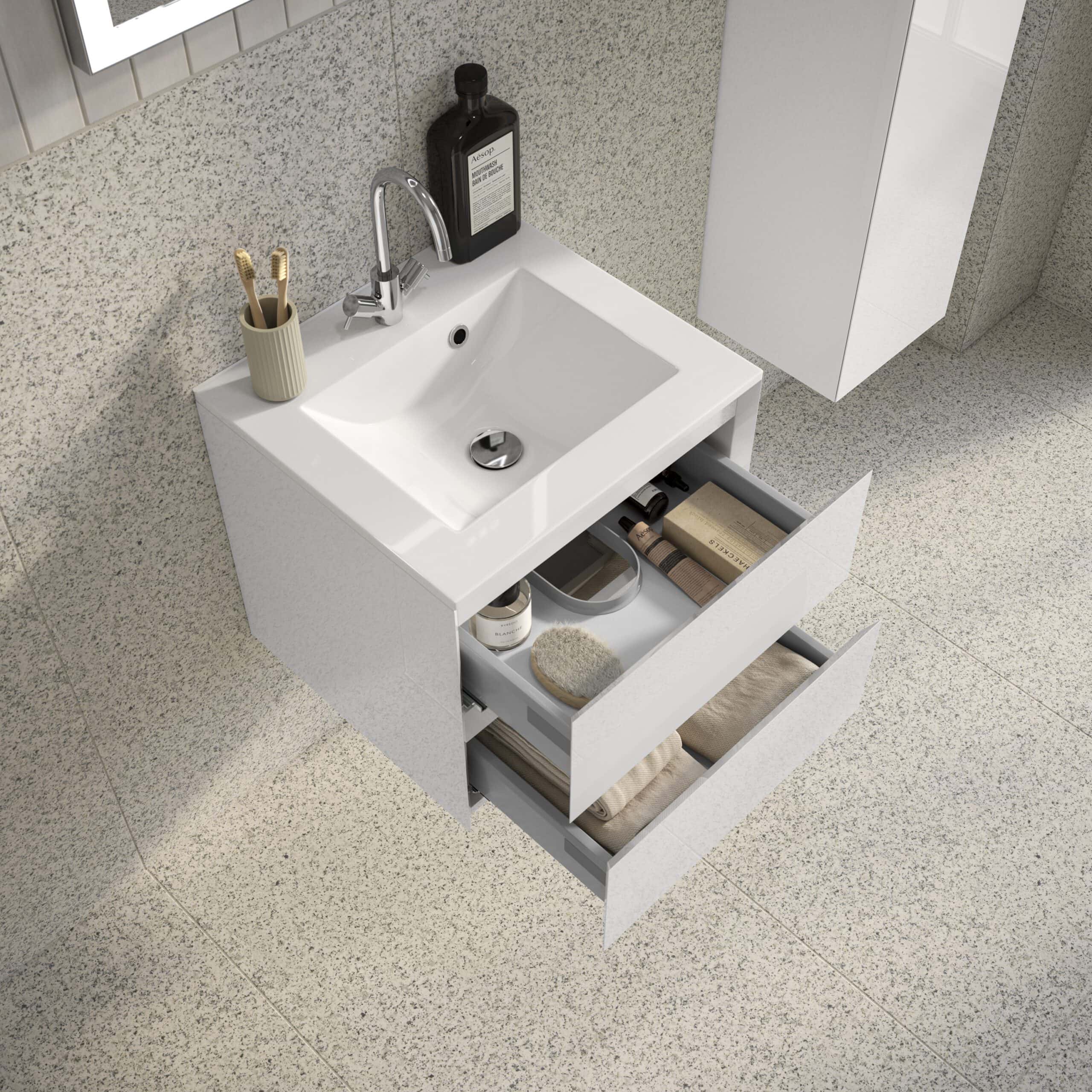 Sleek white bathroom vanity with open drawers featuring bathroom accessories and toiletries, ideal for modern bathroom storage solutions, enhanced by Bubly Bathrooms.