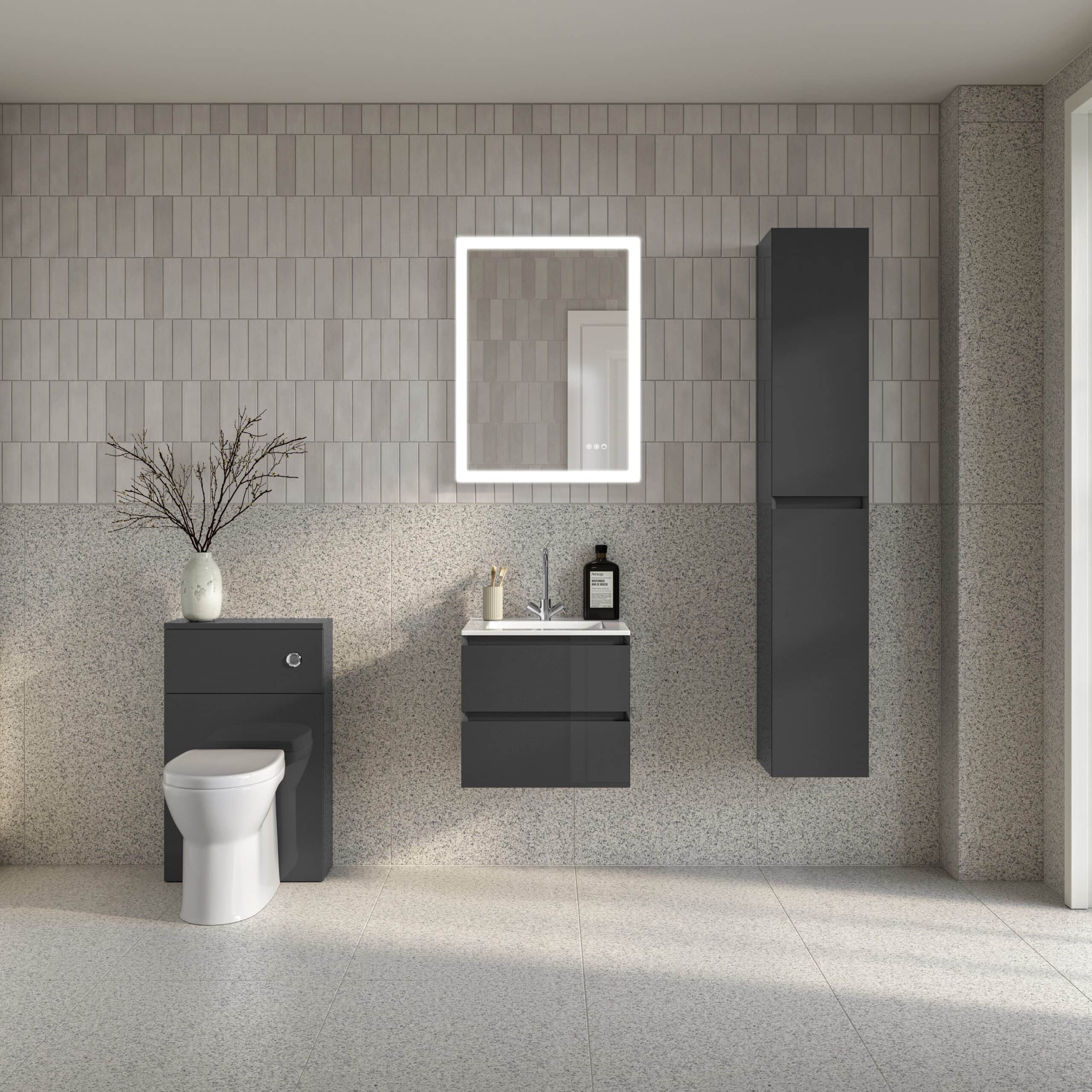 Modern bathroom with sleek grey storage units, a wall-mounted mirror with LED lighting, a white toilet, and minimal decor, showcasing contemporary bathroom design.