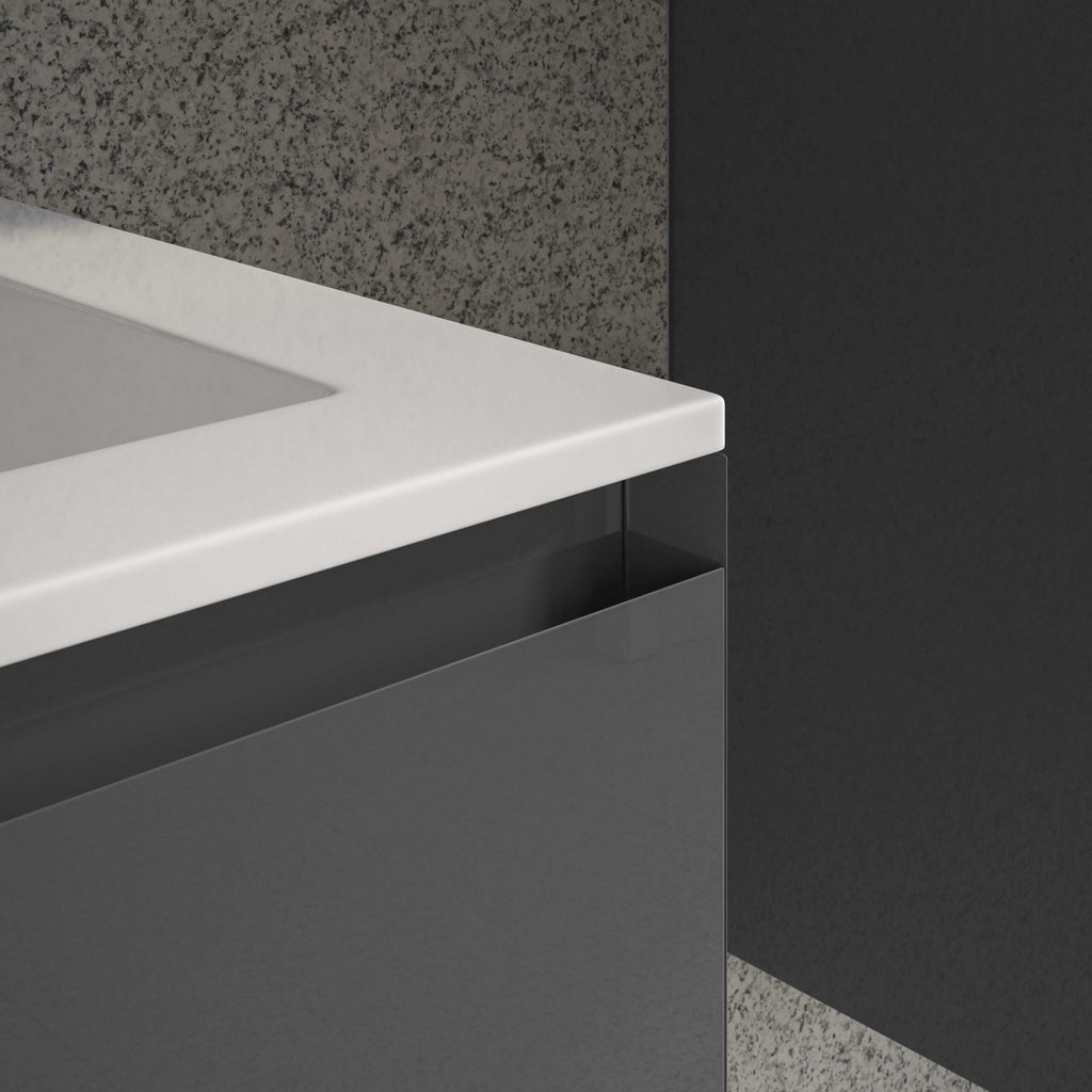 Sleek modern bathroom vanity with a white countertop and integrated sink, featuring minimalist black cabinetry and a textured grey backsplash for a contemporary bathroom design.