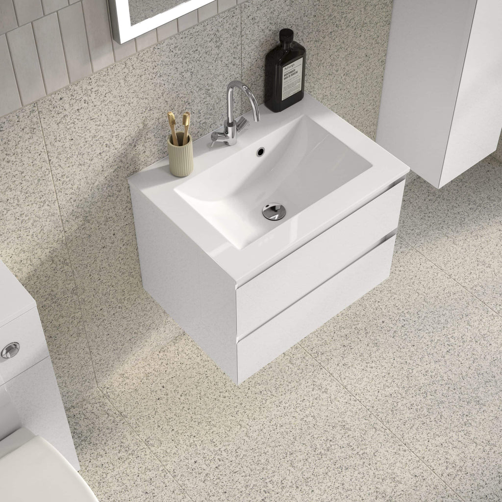 Modern white bathroom vanity with sink and storage drawers in contemporary bathroom decor.