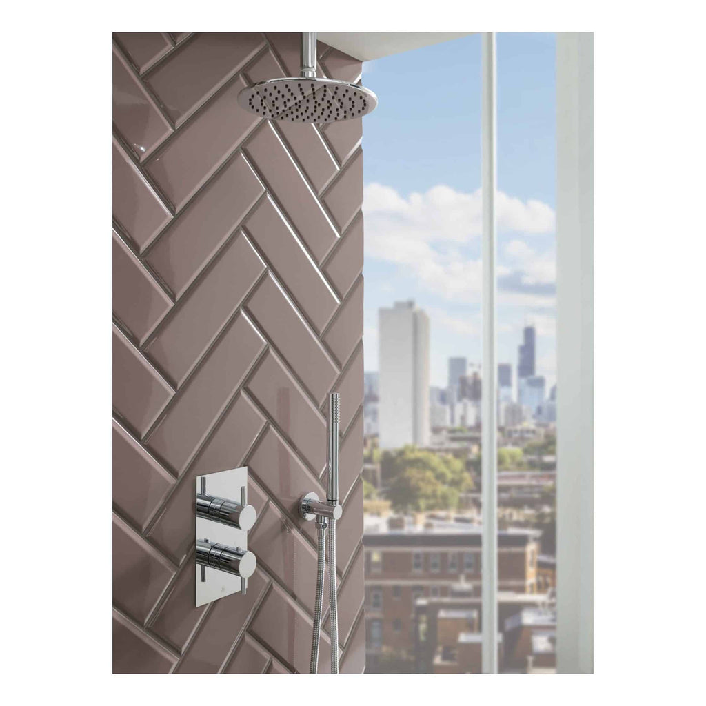 Modern shower system with rain shower head, handheld shower, and sleek controls in a contemporary bathroom with city skyline view.