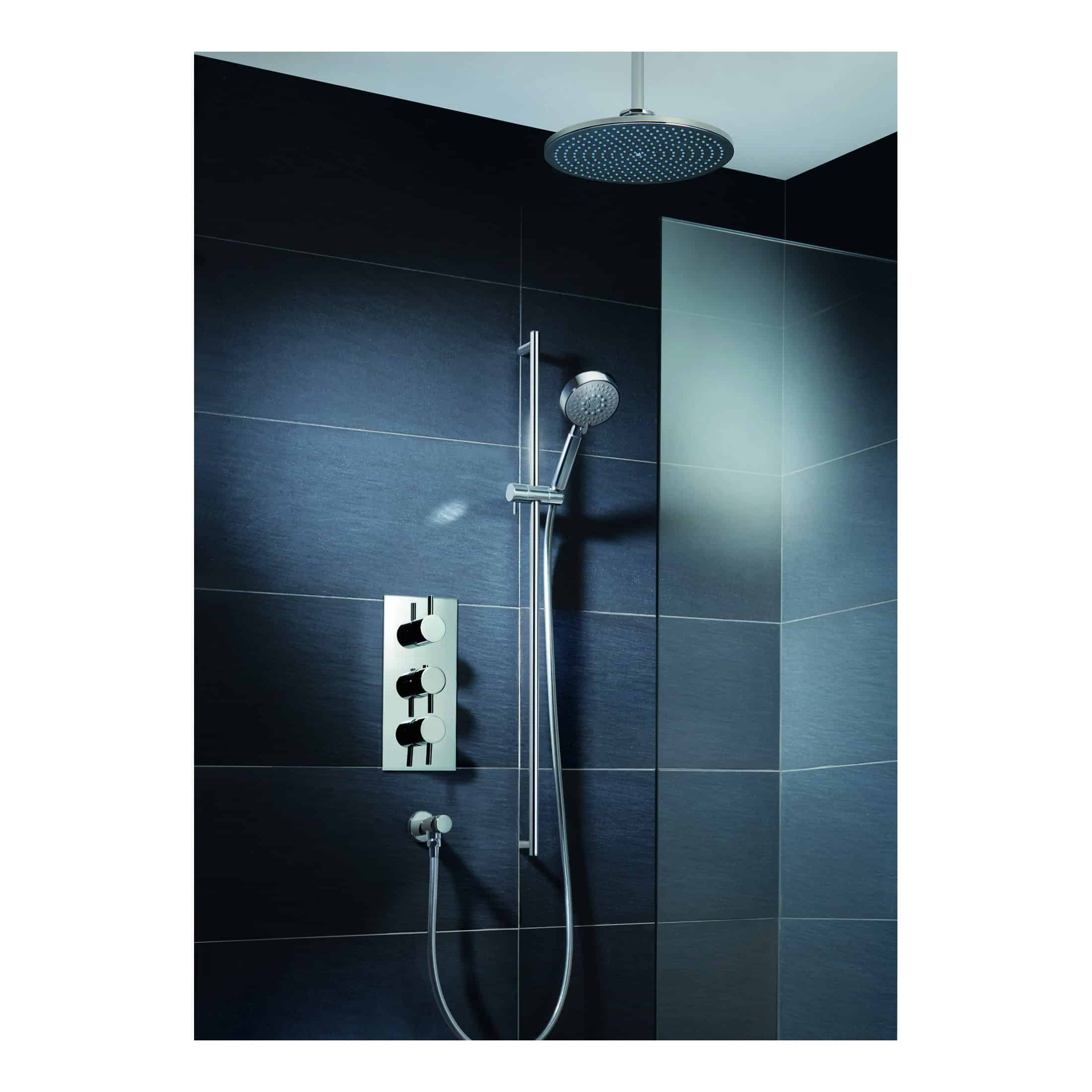 High-quality modern shower head and mixer system installed in a sleek, dark-tiled bathroom, representing contemporary bathroom design trends.