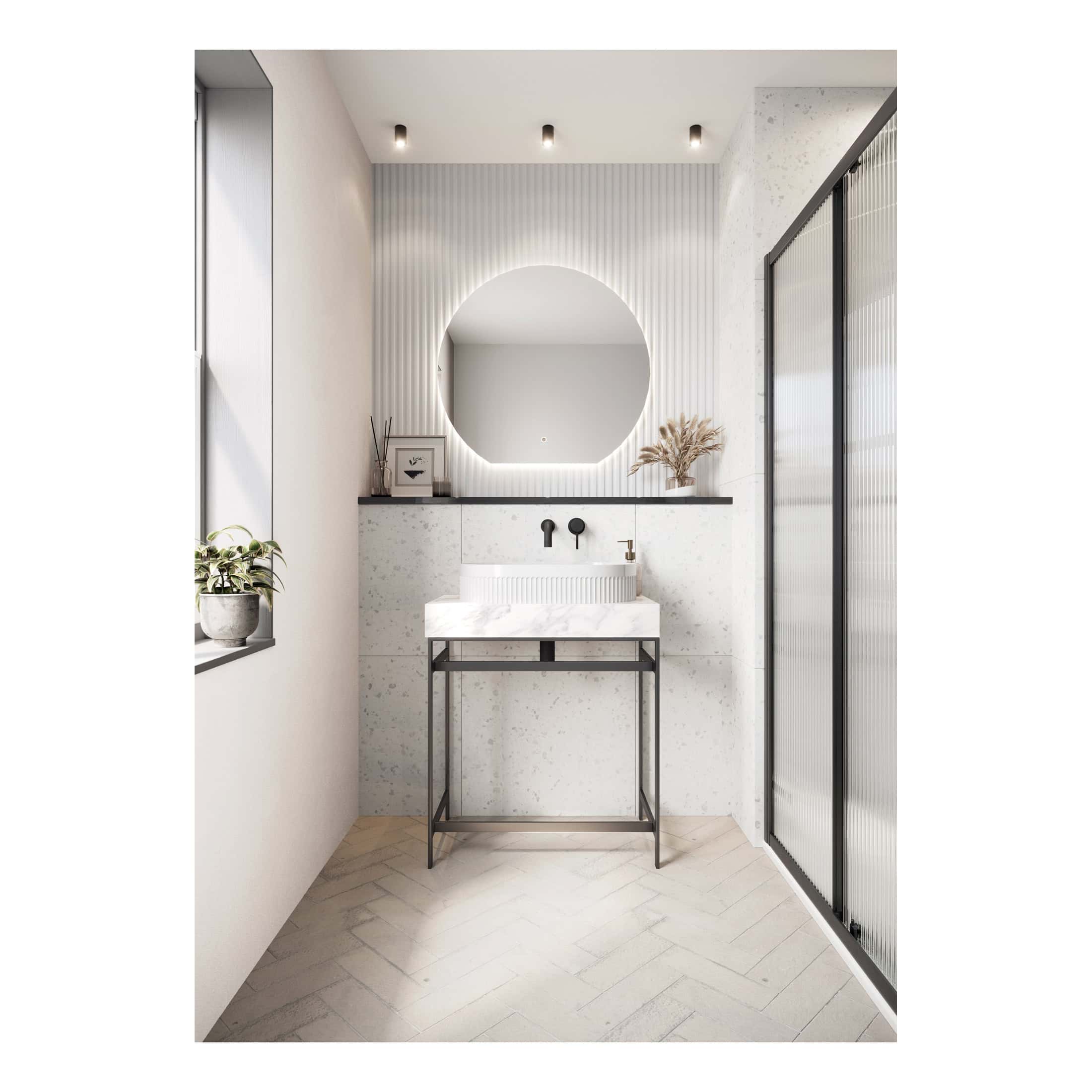 Minimalist modern bathroom with round backlit mirror, white terrazzo vanity, black fixtures, and sleek black-framed glass shower enclosure, perfect for contemporary bathroom design.
