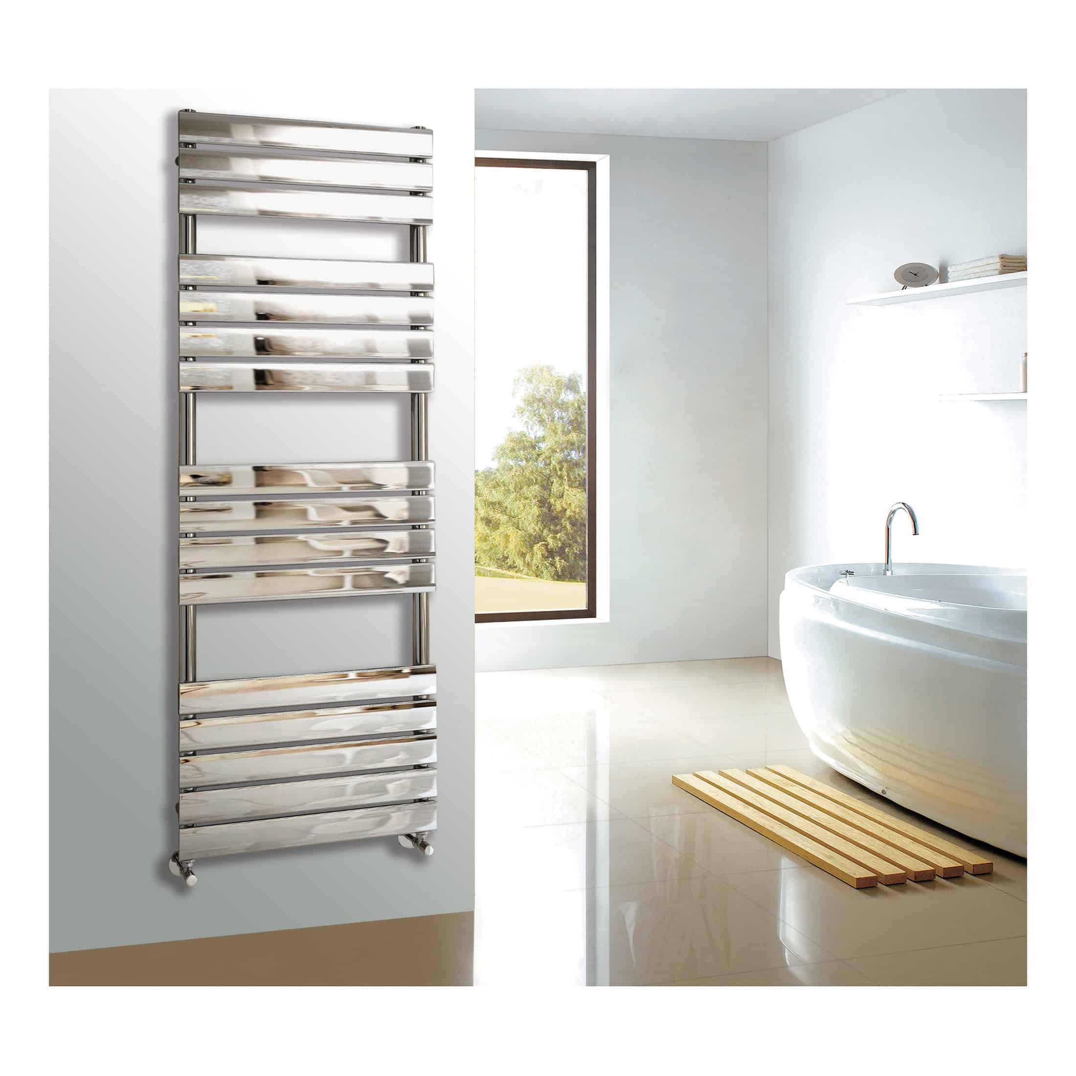 Polished chrome towel radiator in modern bathroom with freestanding bathtub, minimalist decor, natural light, and wooden bath mat, ideal for contemporary bathroom heating solutions.