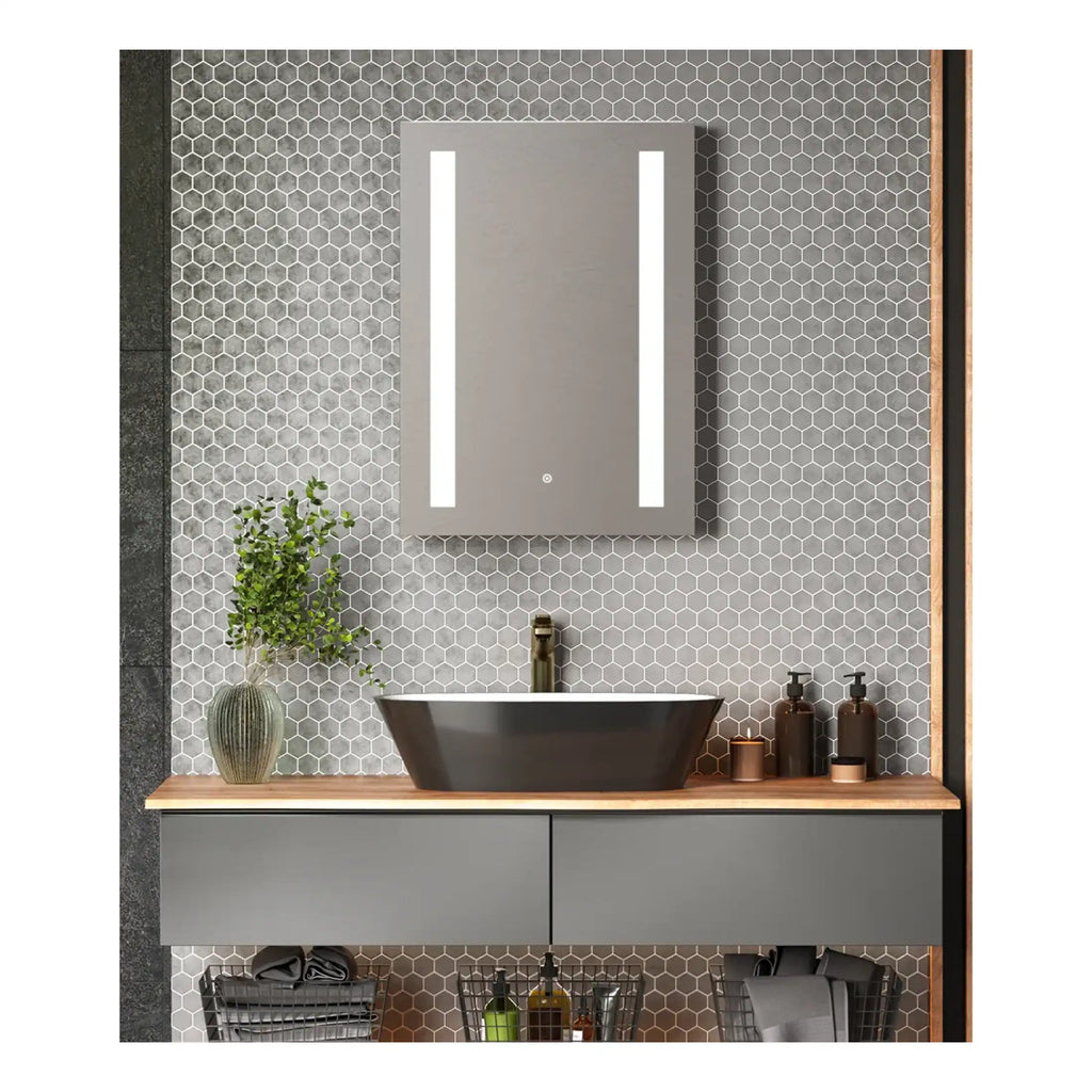 Modern grey bathroom vanity with a sleek vessel sink, illuminated mirror, and stylish accessories, featuring contemporary design elements by Bubly Bathrooms.