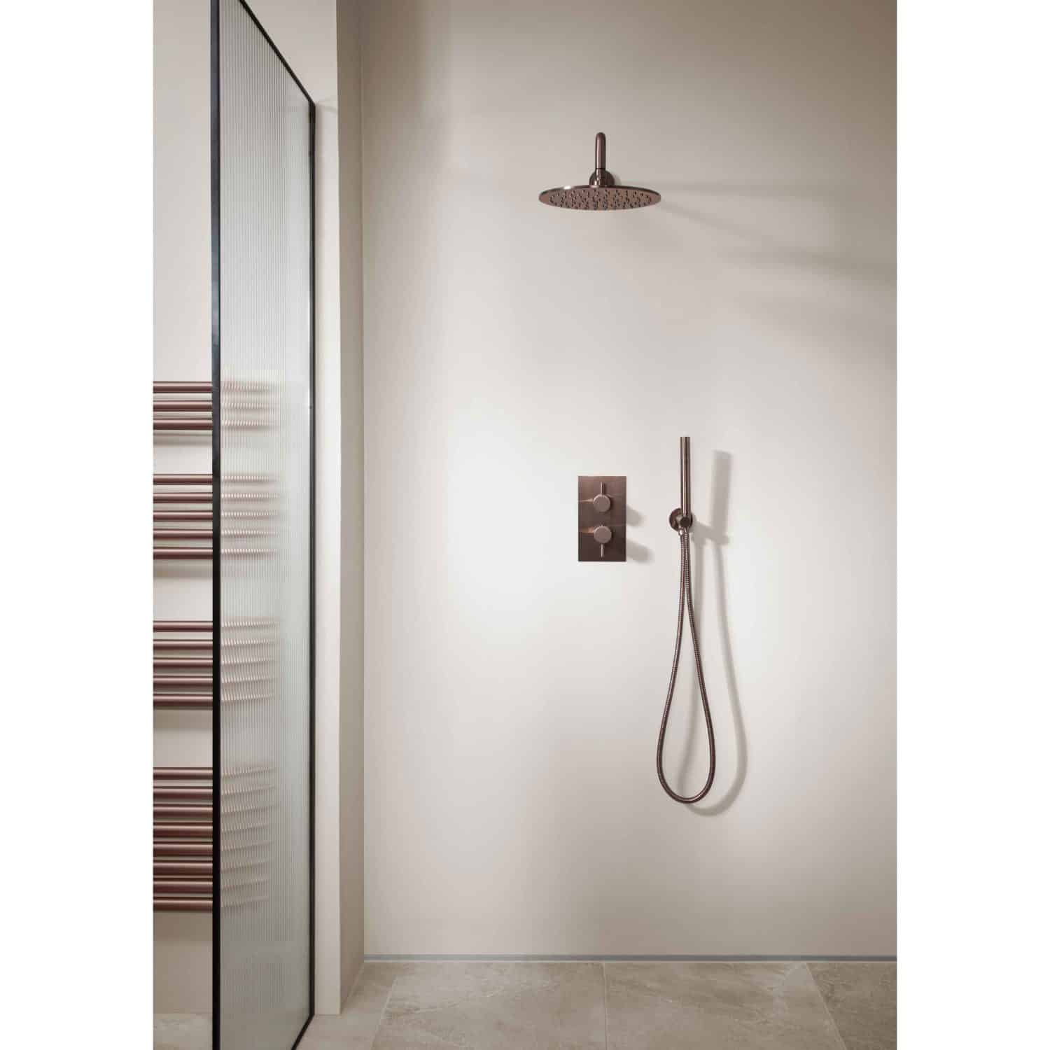 Modern shower area with a rainfall showerhead and handheld shower on a sleek white wall, complemented by a glass door and minimalistic design, ideal for contemporary bathroom renovations.