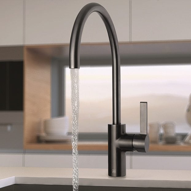 Sleek modern kitchen tap with water flowing, featuring a high-arc design and matte black finish for contemporary bathroom or kitchen renovations.