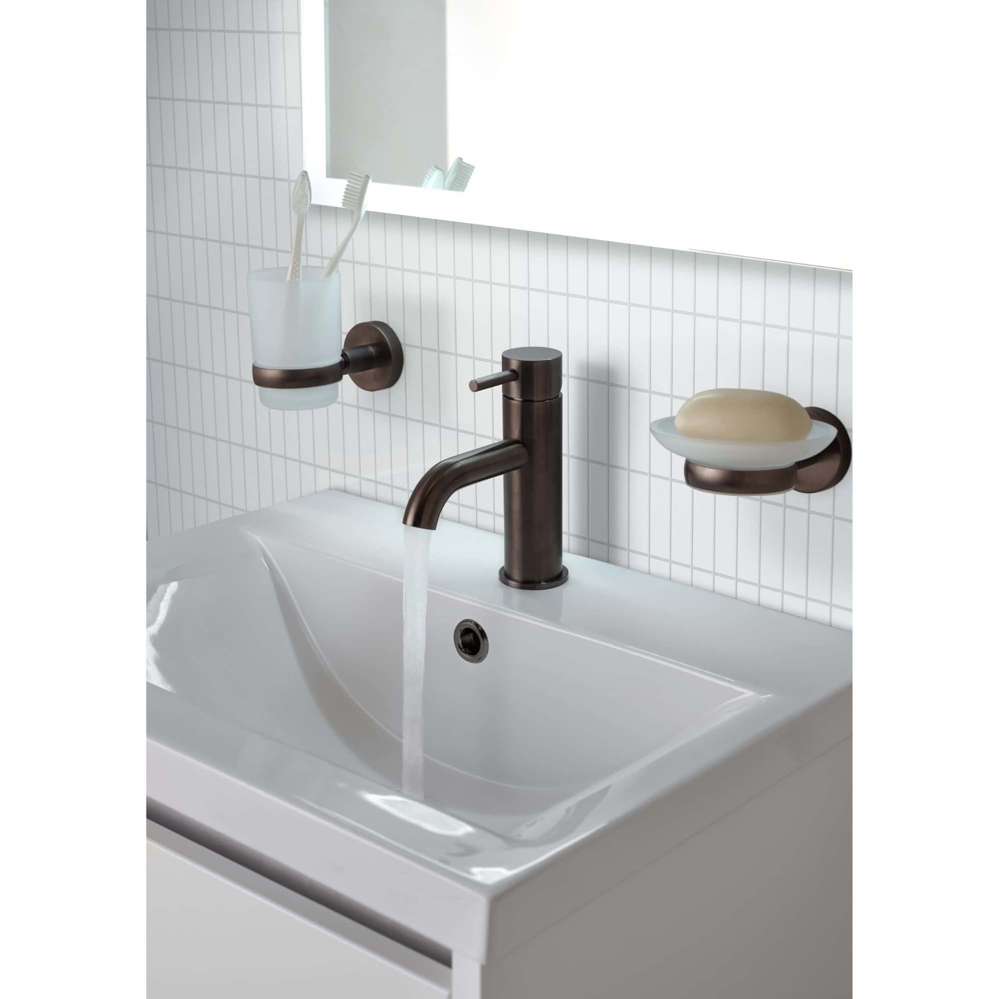 Shower faucet with running water in modern bathroom, close-up shot.