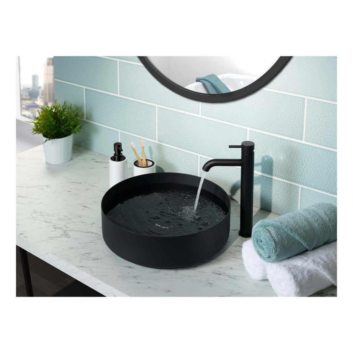 Sleek black bathroom sink with modern matte black tap, set on a white marble countertop with soft blue tiles in the background. Perfect for stylish bathroom remodels and contemporary designs.
