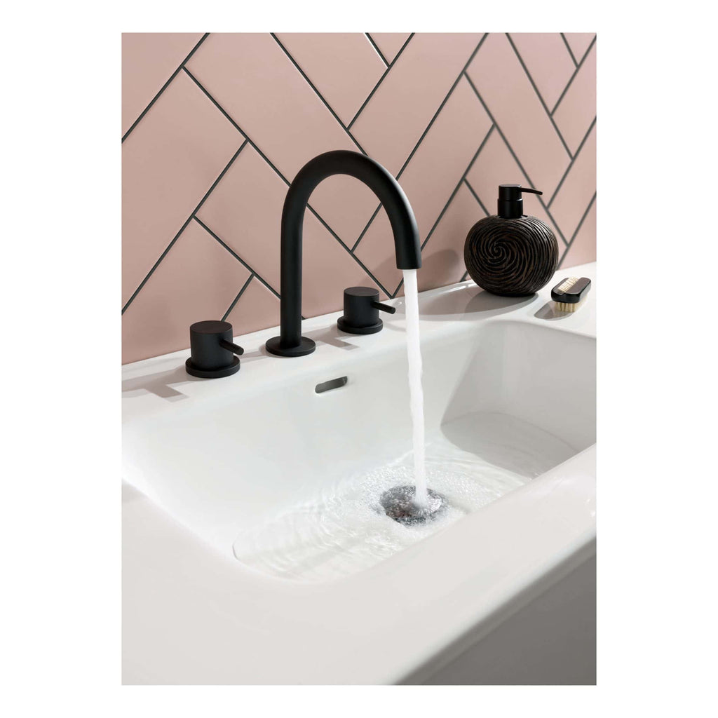 Sleek black bathroom tap with modern fixtures in a contemporary bathroom setting, featuring a minimalistic design and elegant accessories for a stylish bathroom renovation.
