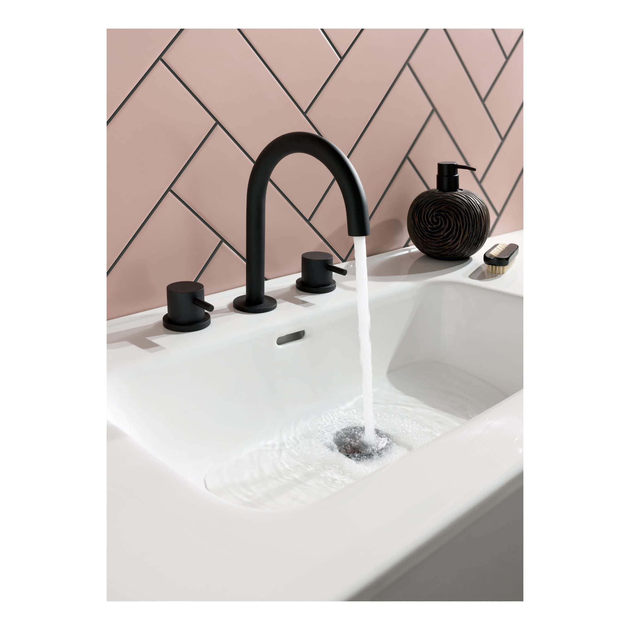 Sleek black bathroom tap with modern fixtures in a contemporary bathroom setting, featuring a minimalistic design and elegant accessories for a stylish bathroom renovation.