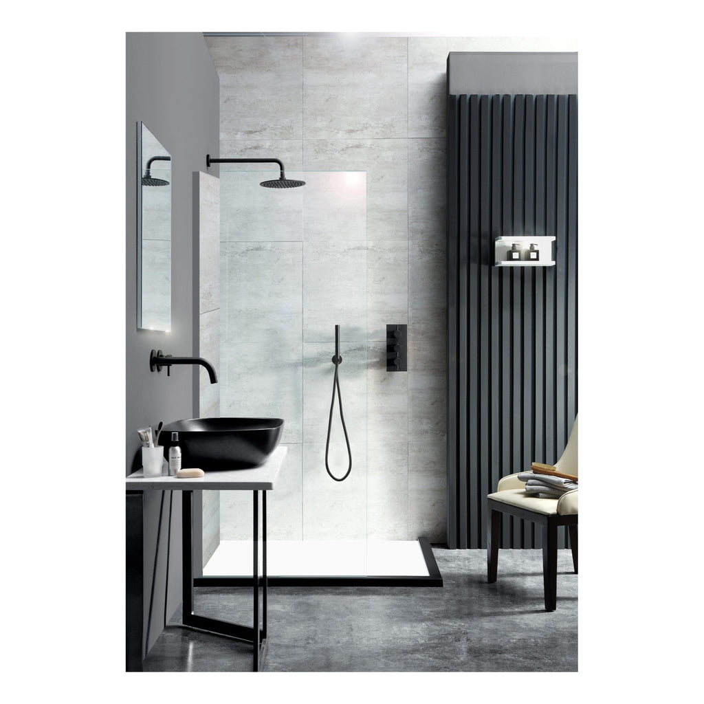 Sleek modern bathroom with black fixtures, minimalist shower area, and contemporary decor featuring a stylish black basin and a comfortable chair - ideal for luxury bathroom design.