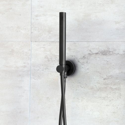 Black handheld showerhead with hose mounted on a grey tiled bathroom wall, modern and sleek design, ideal for contemporary Bubly bathrooms.