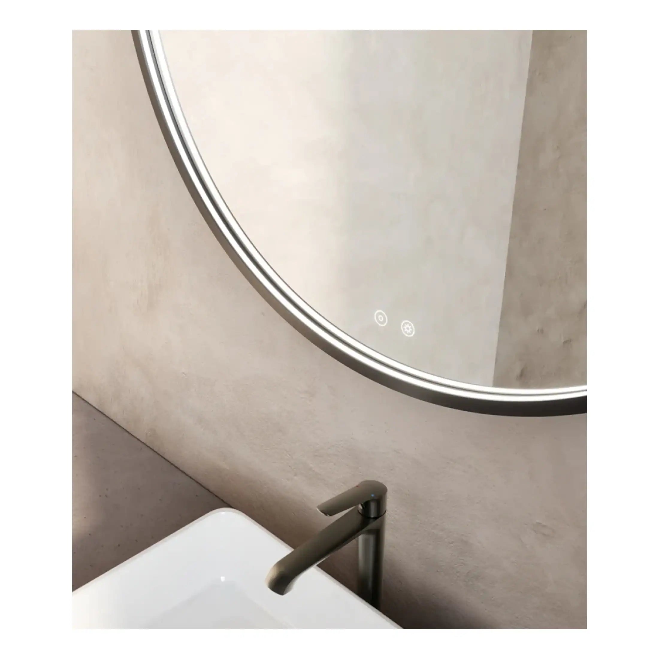 Sleek modern bathroom mirror with integrated LED lighting and touch control, positioned above a minimalist white sink and brushed metal tap, in a contemporary bathroom design.