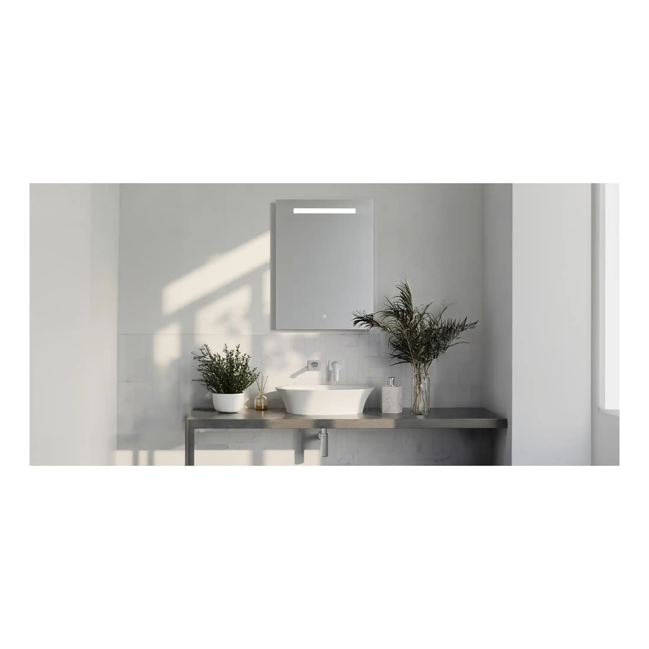Contemporary minimalist bathroom featuring a sleek vessel sink, large mirror with integrated lighting, and elegant decor with green plants, creating a clean and serene atmosphere.
