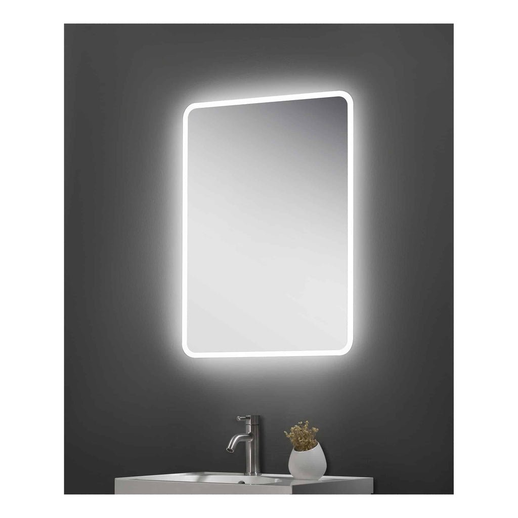 Illuminated bathroom mirror with LED lighting over sink, modern bathroom vanity with faucet and decorative plant, minimalistic design perfect for contemporary bathrooms.