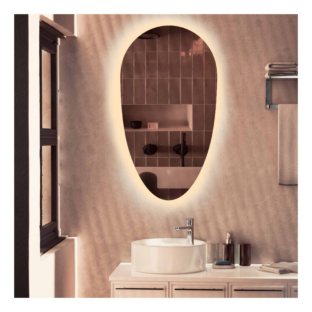 Modern bathroom vanity with illuminated oval mirror and vessel sink, minimalist design with neutral tones and sleek fixtures, perfect for contemporary bathroom décor.