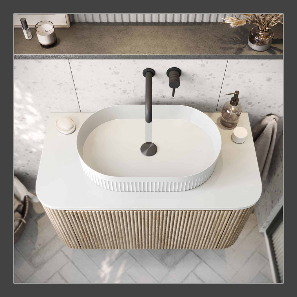 Sink basin with modern black faucet and beige wooden vanity, minimalist bathroom decor with soap dispenser and decorative accents, stylish and contemporary bathroom design.