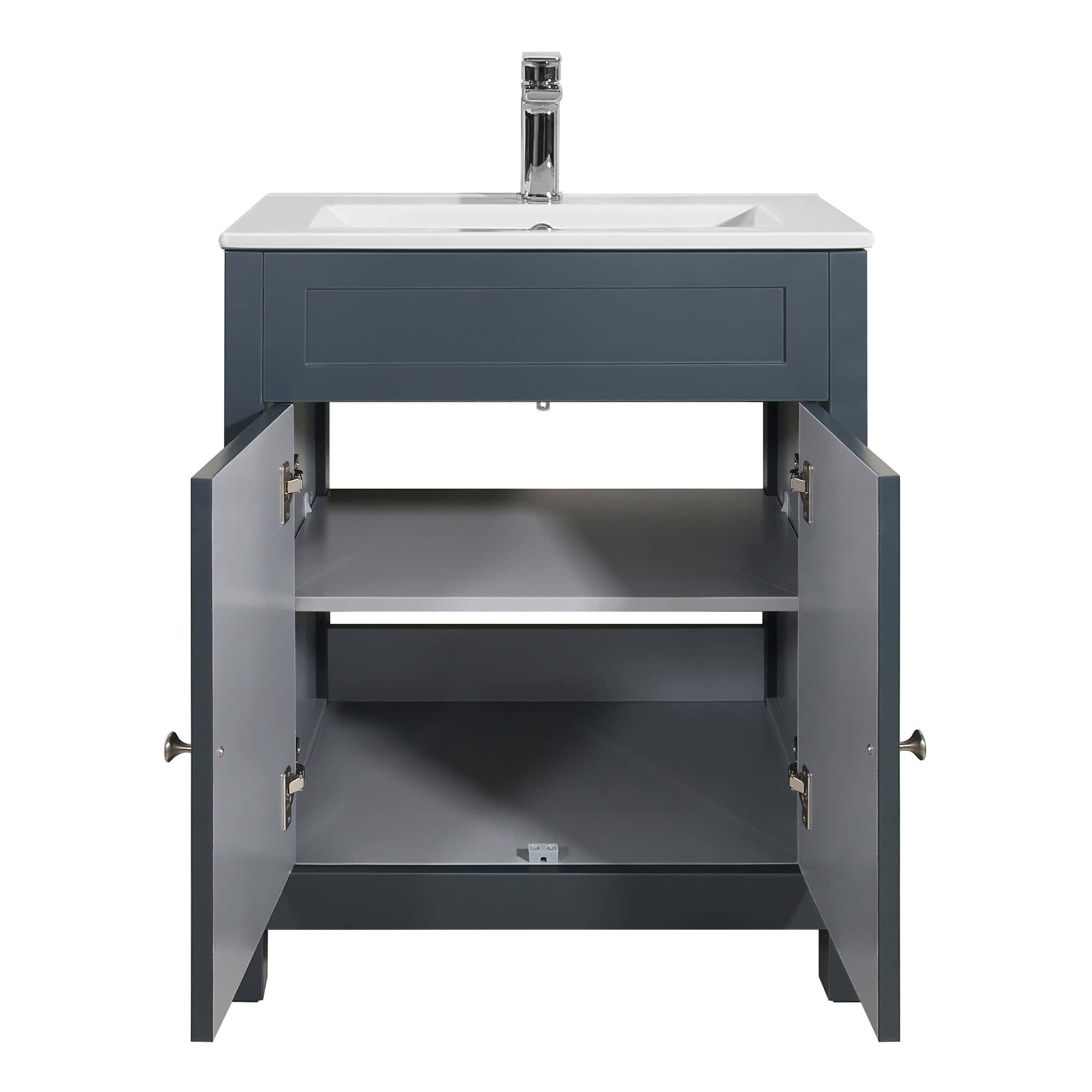 Modern grey bathroom vanity unit with a white ceramic sink and chrome tap, featuring open storage drawers; perfect for contemporary bathroom design.