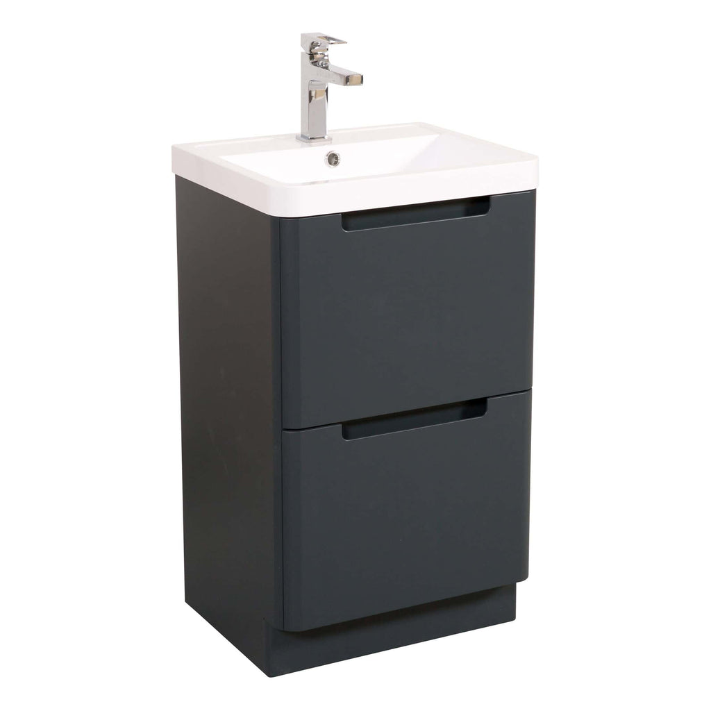 Modern bathroom vanity unit with integrated sink and chrome faucet, ideal for contemporary bathroom designs. Compact storage solution with sleek dark grey finish. Perfect for small and stylish bathroom spaces.