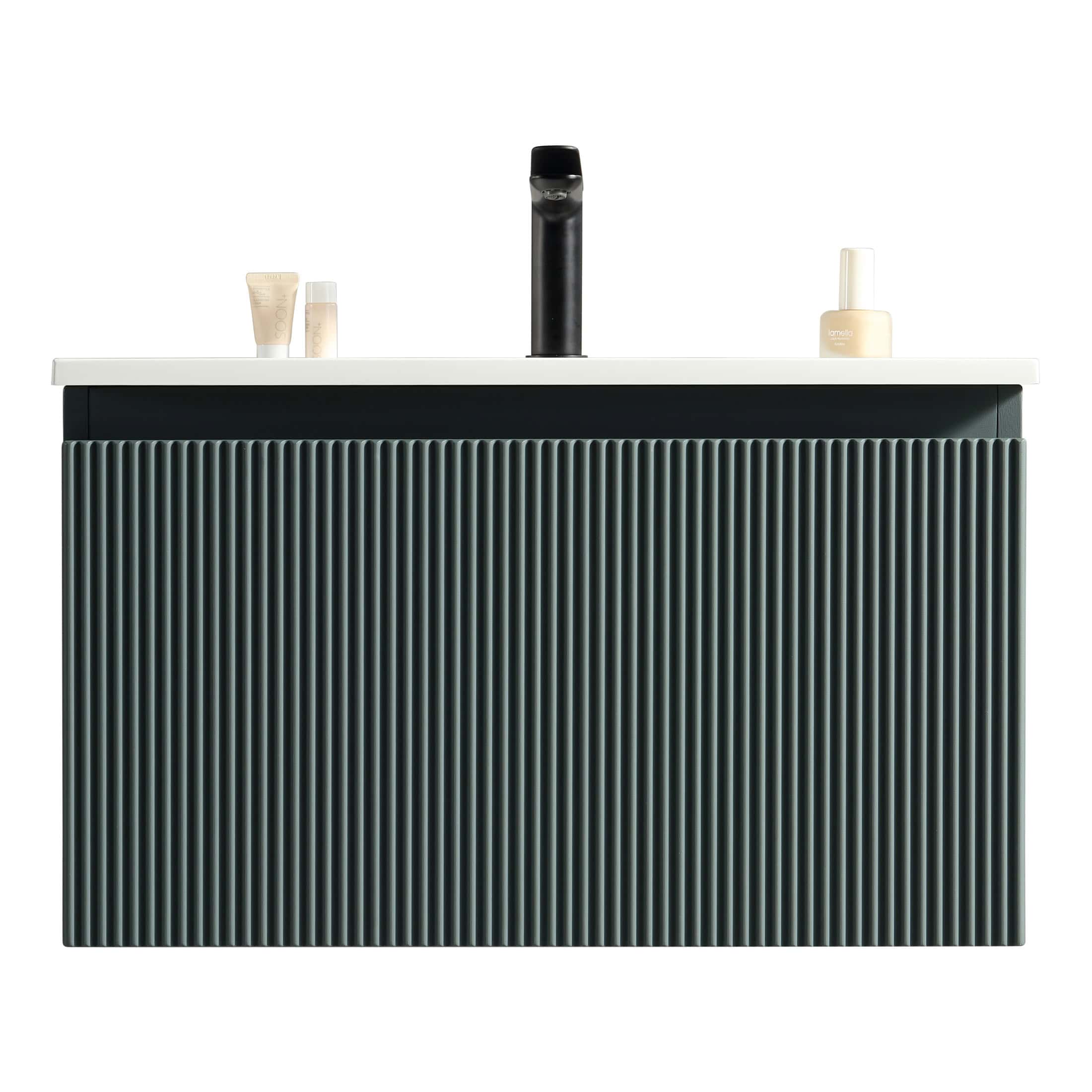 Sleek black and white modern bathroom vanity with vertical ribbed design, minimalist black faucet, and neatly arranged toiletries, perfect for contemporary bathroom interiors.