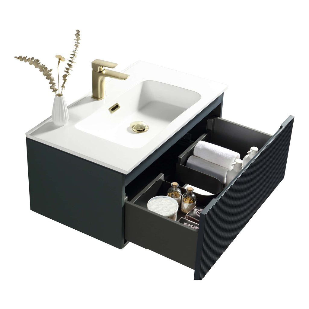 White bathroom vanity unit with black drawer, brass faucet, and storage for toiletries, towels, and skincare products, ideal for modern bathroom decor.