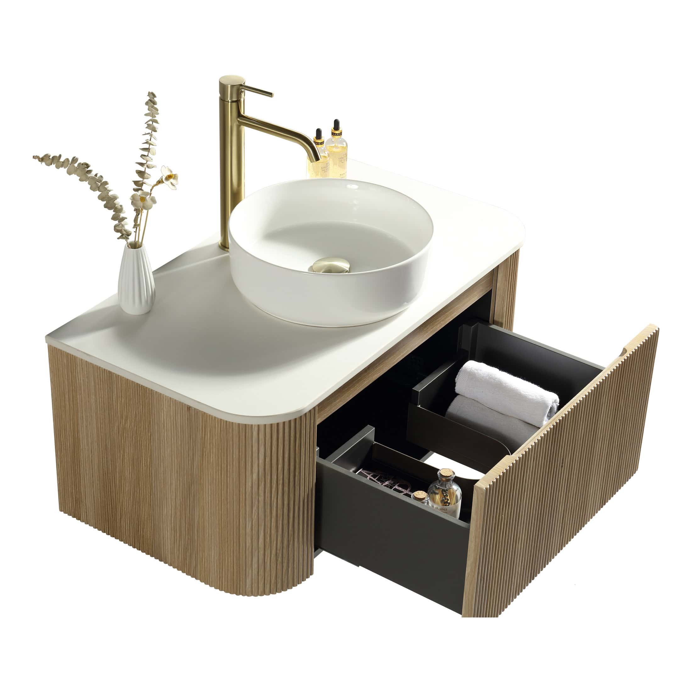 Sleek modern bathroom vanity with a white countertop, round vessel sink, gold faucet, and open black drawers containing towels and toiletries, showcasing stylish bathroom design.