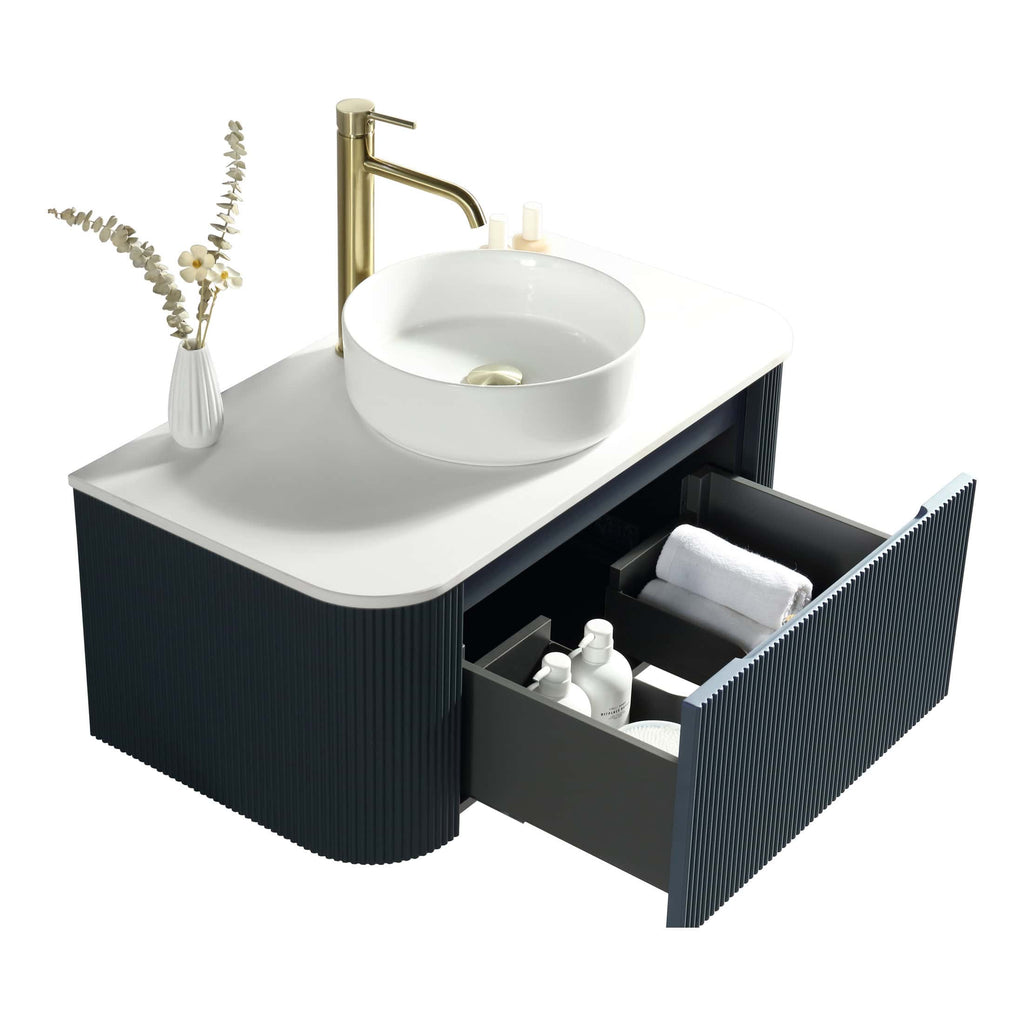 Contemporary bathroom vanity unit with a stylish black and white design, featuring a round ceramic basin, gold tap, and open storage drawer with towels and toiletries. Perfect for modern bathroom decor.