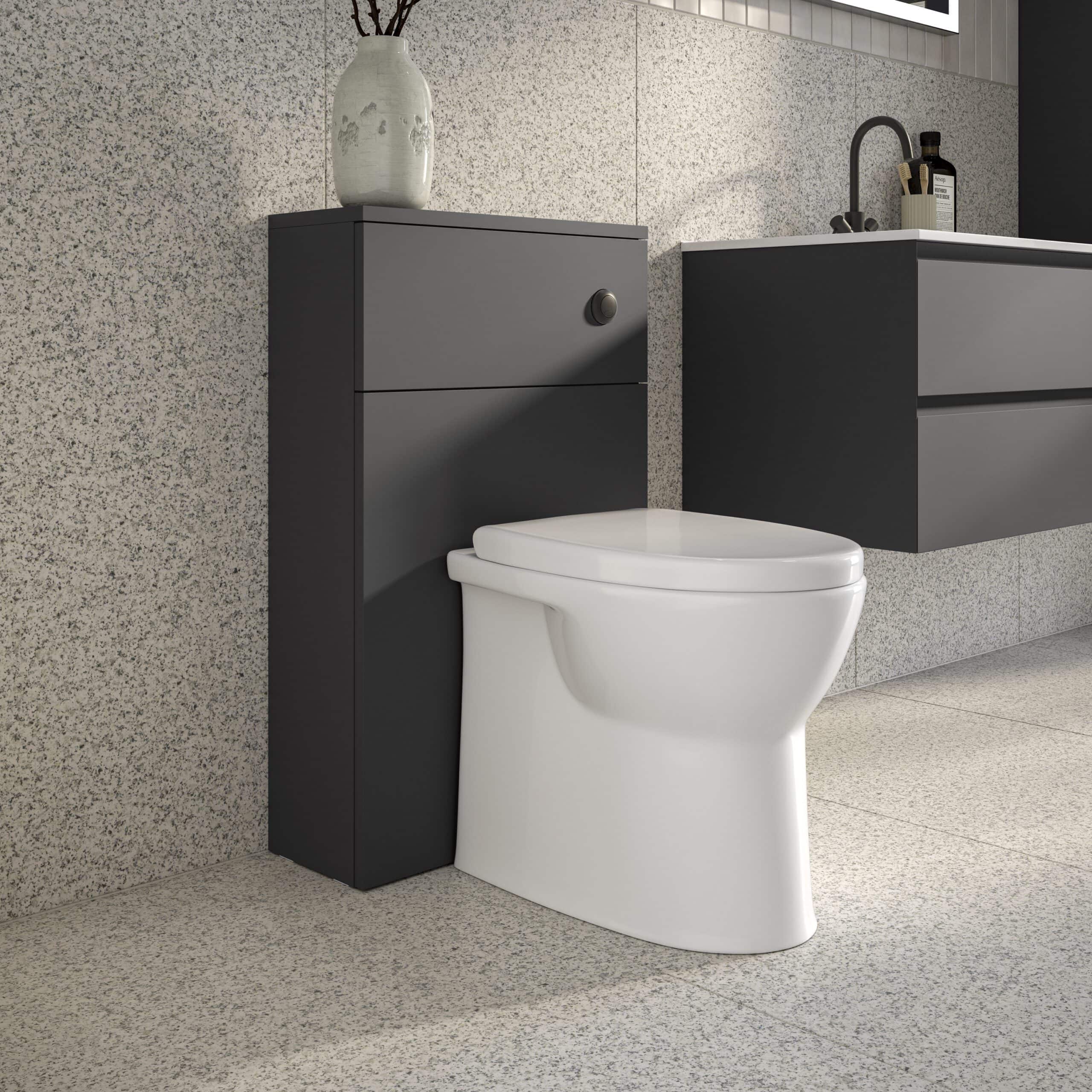 Contemporary bathroom with a modern white toilet, dark grey storage units, and minimalist decor, highlighting sleek bathroom furniture and fixtures for stylish bathroom design.