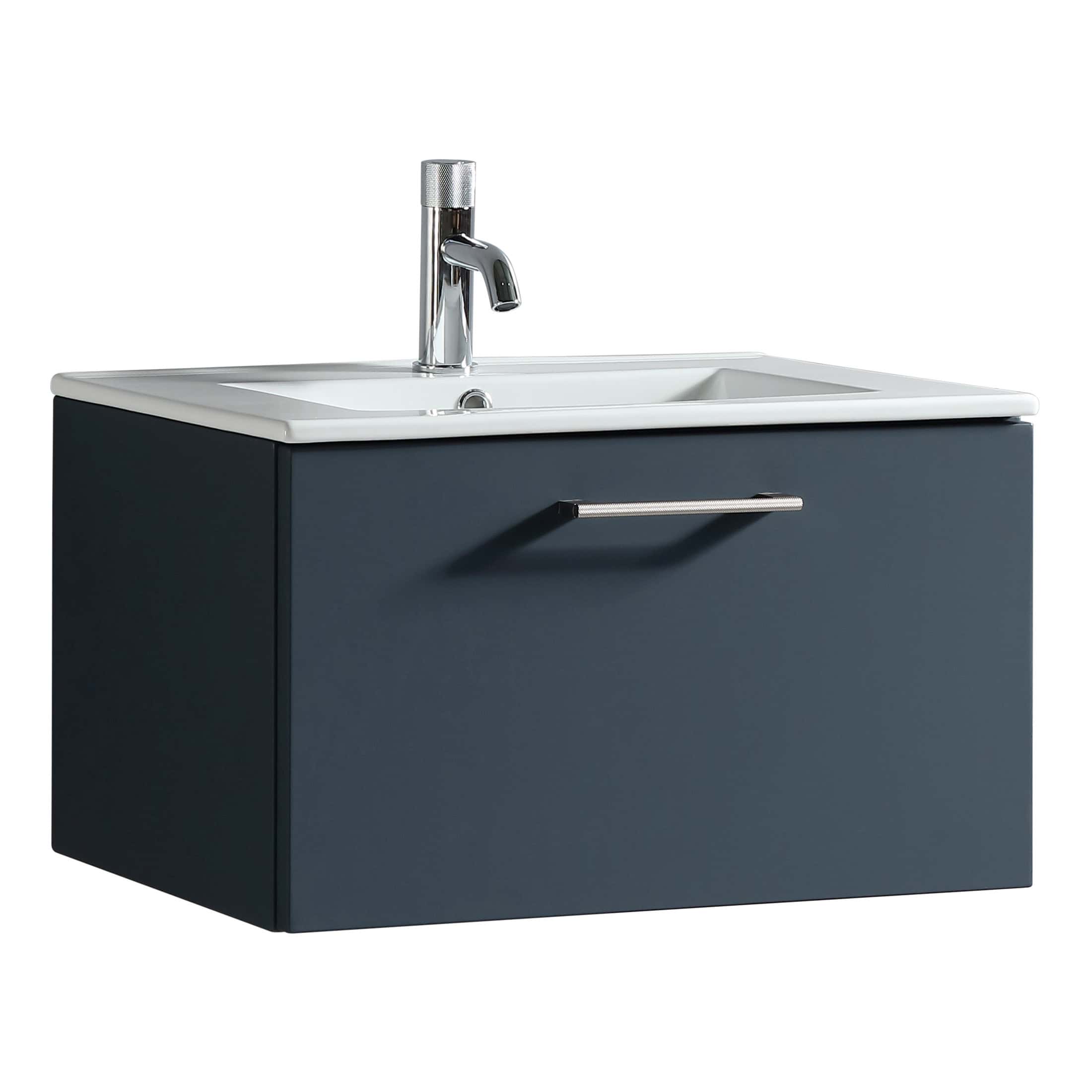 Sleek navy bathroom vanity with integrated sink and modern chrome faucet, perfect for contemporary bathroom designs. Space-saving storage with stylish handle for easy access.
