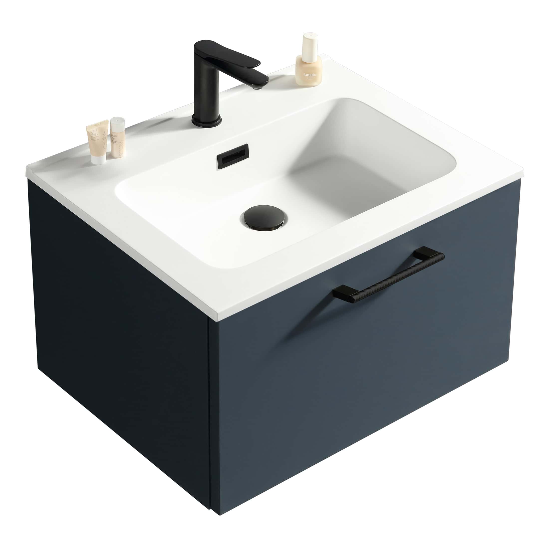 Sleek modern bathroom vanity with a white countertop, black tap, and navy blue cabinet featuring a handle for stylish bathroom storage.