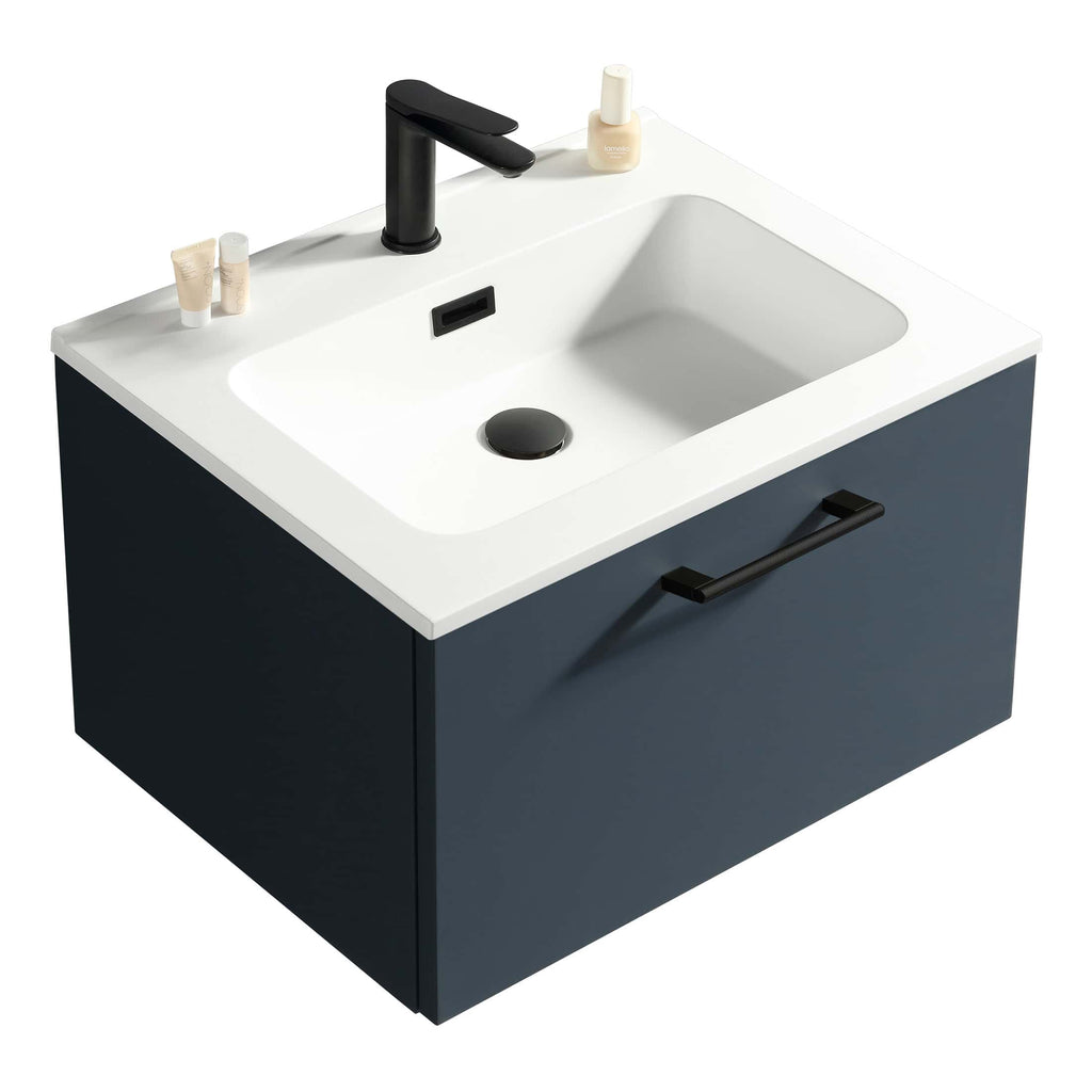 Sleek modern bathroom vanity with a white countertop, black tap, and navy blue cabinet featuring a handle for stylish bathroom storage.