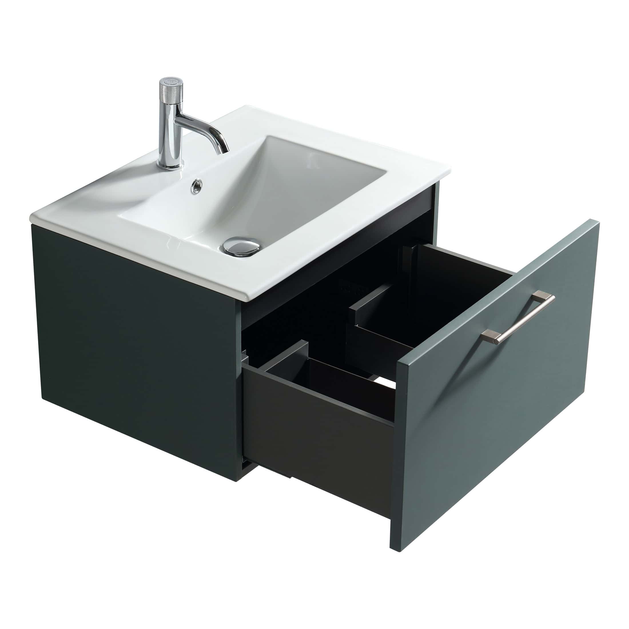Modern bathroom vanity unit with integrated sink and storage drawers, ideal for contemporary bathroom renovation projects. Features sleek, minimalist design with black and white colour scheme.