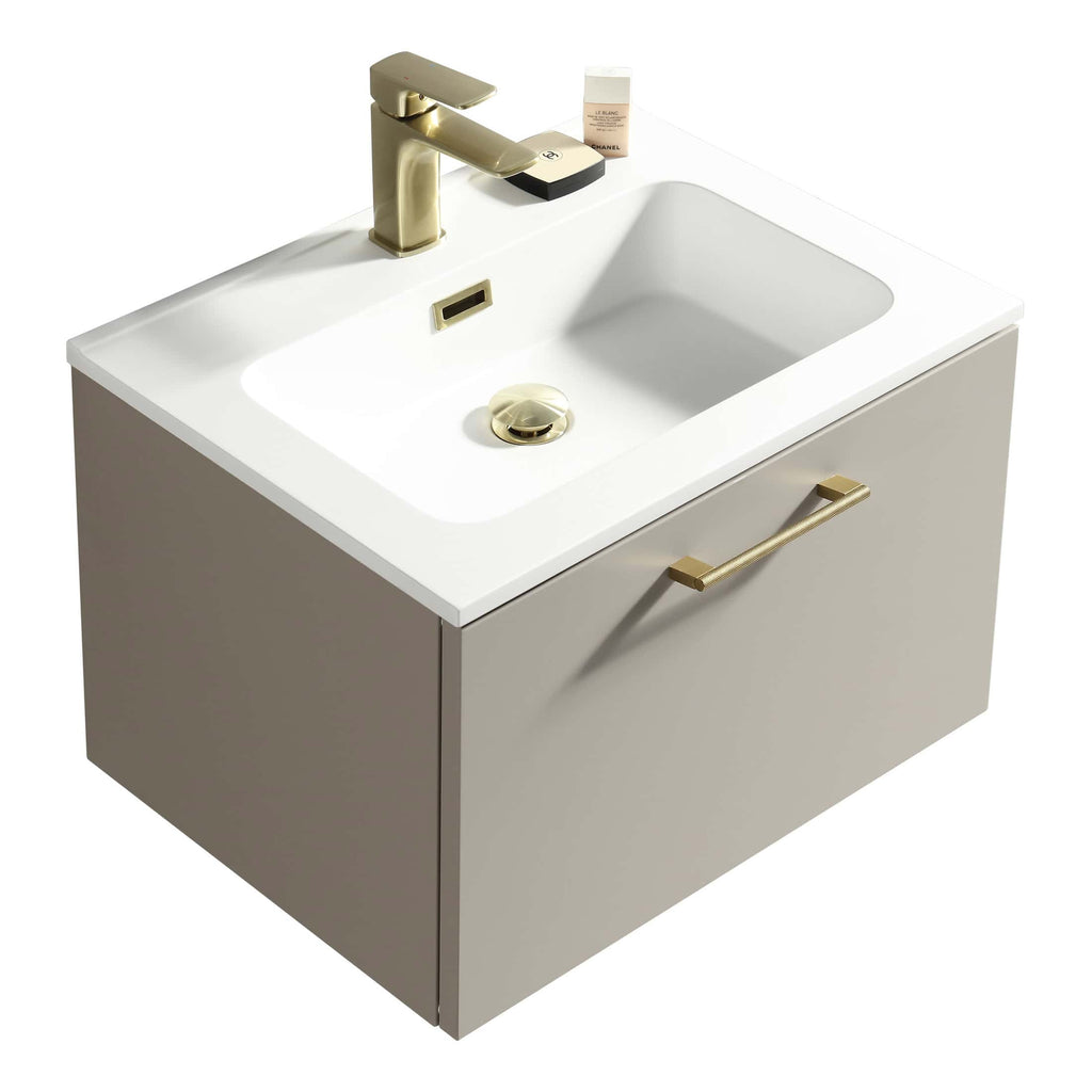 Polished gold bathroom vanity sink with a modern rectangular design, featuring a sleek gold faucet, soap dispenser, and handle, perfect for contemporary bathroom remodels.