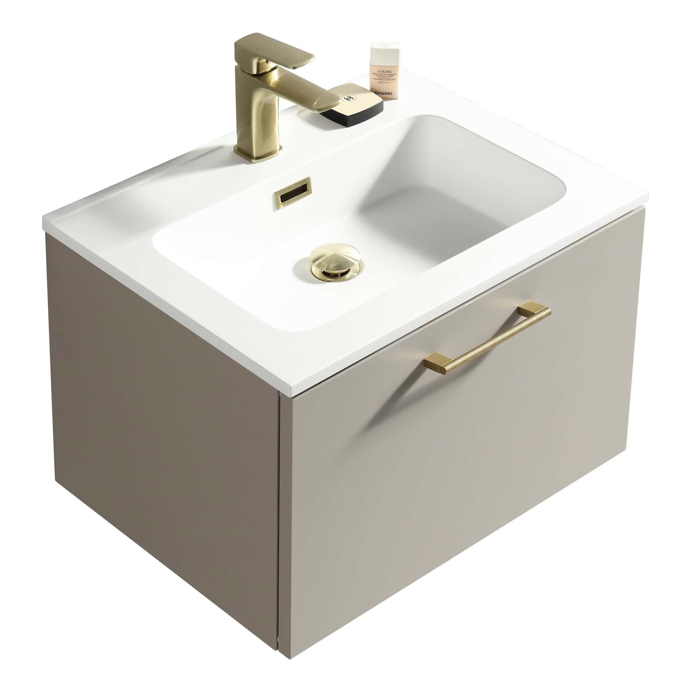 Polished gold bathroom vanity sink with a modern rectangular design, featuring a sleek gold faucet, soap dispenser, and handle, perfect for contemporary bathroom remodels.