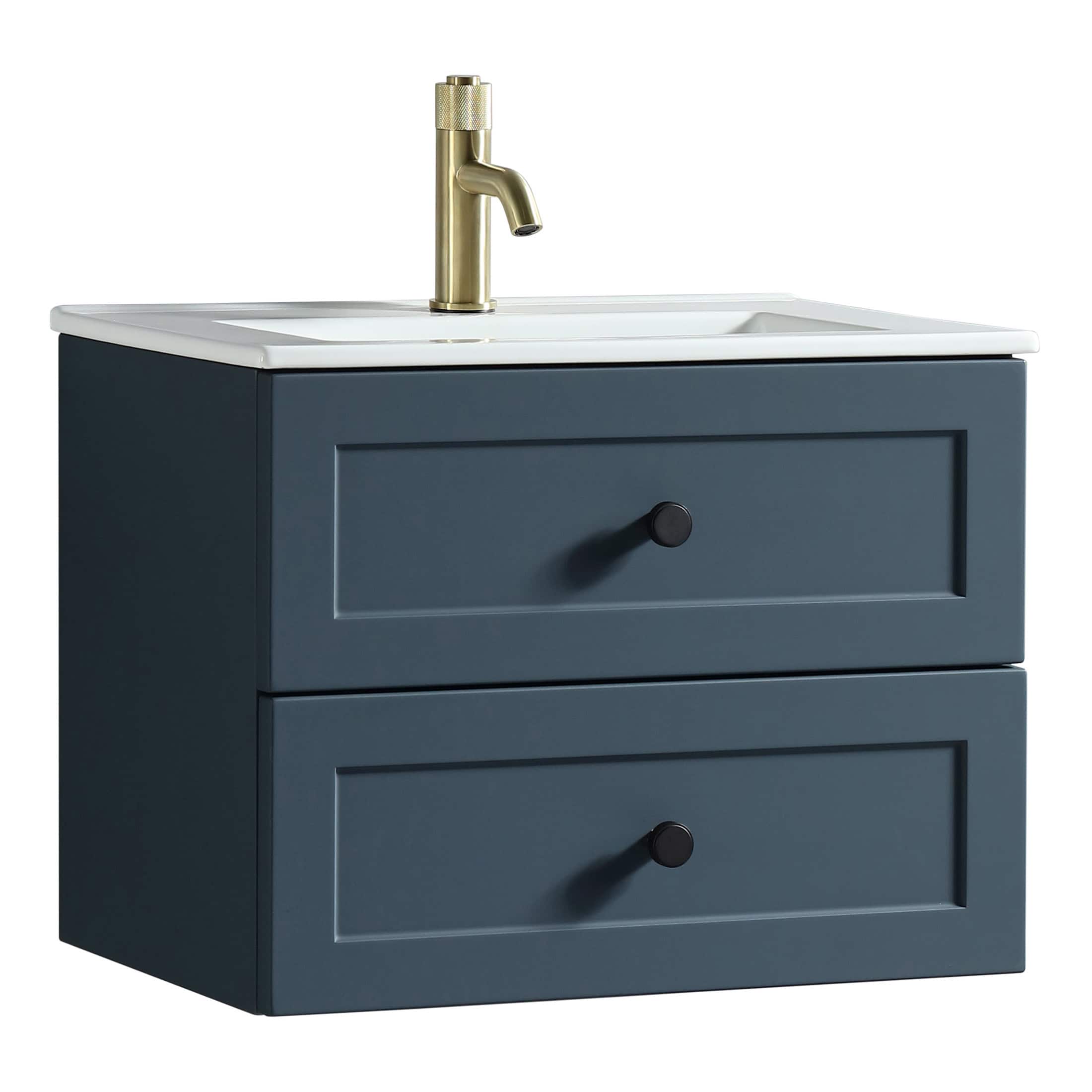 Elegant navy blue bathroom vanity with two drawers and a white ceramic sink, featuring a brass modern faucet, ideal for contemporary bathroom interior design.