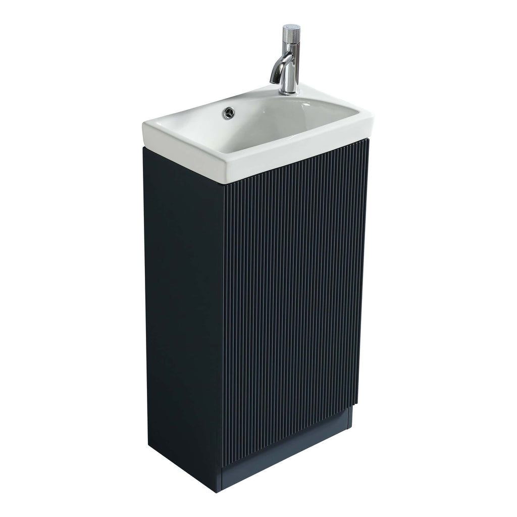 Black bathroom vanity unit with integrated white ceramic sink and chrome faucet, modern design perfect for contemporary bathrooms.