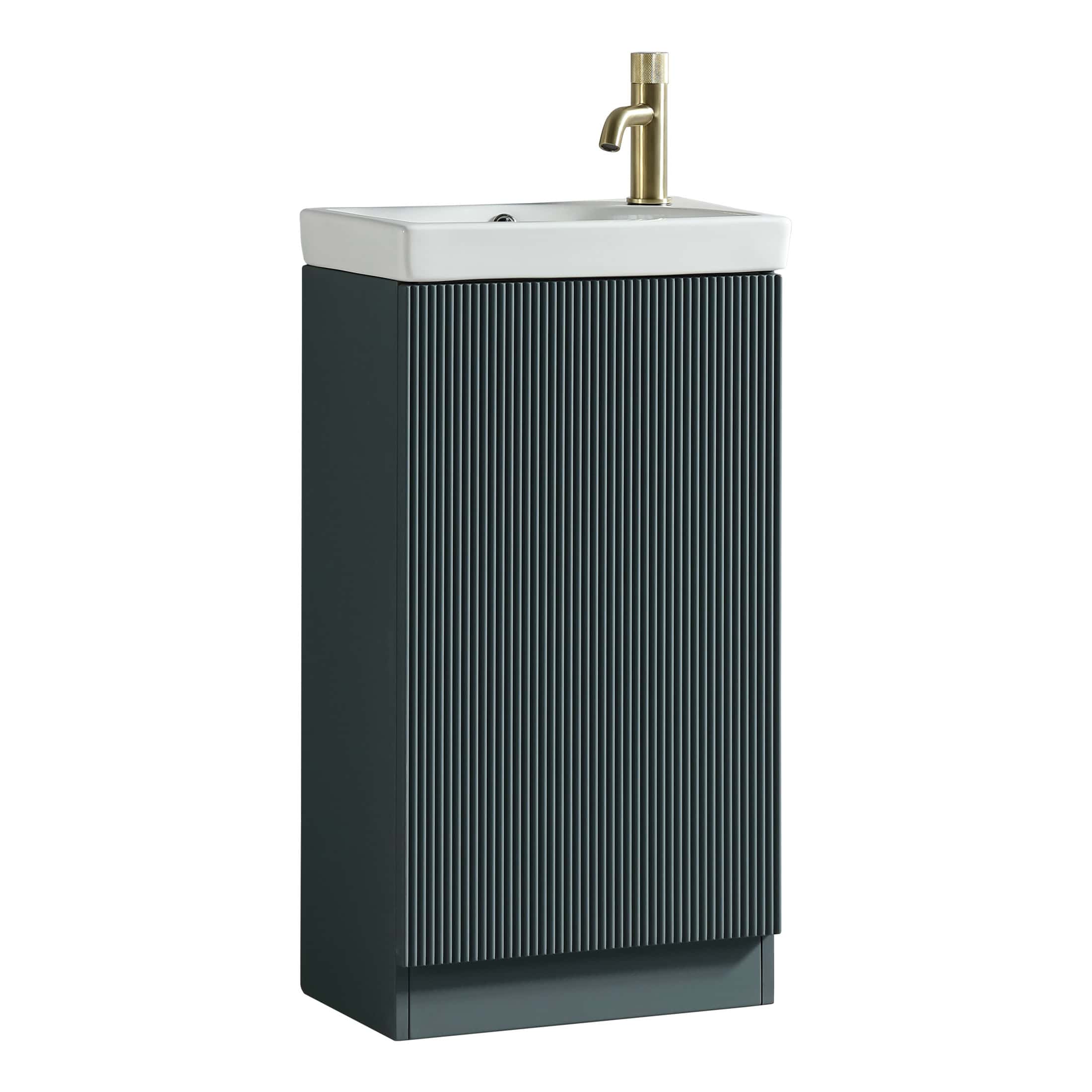 Sleek bathroom sink with integrated cabinet and modern matte black finish, featuring a stylish brass faucet for contemporary bathroom decor. Perfect for compact, elegant bathroom spaces.