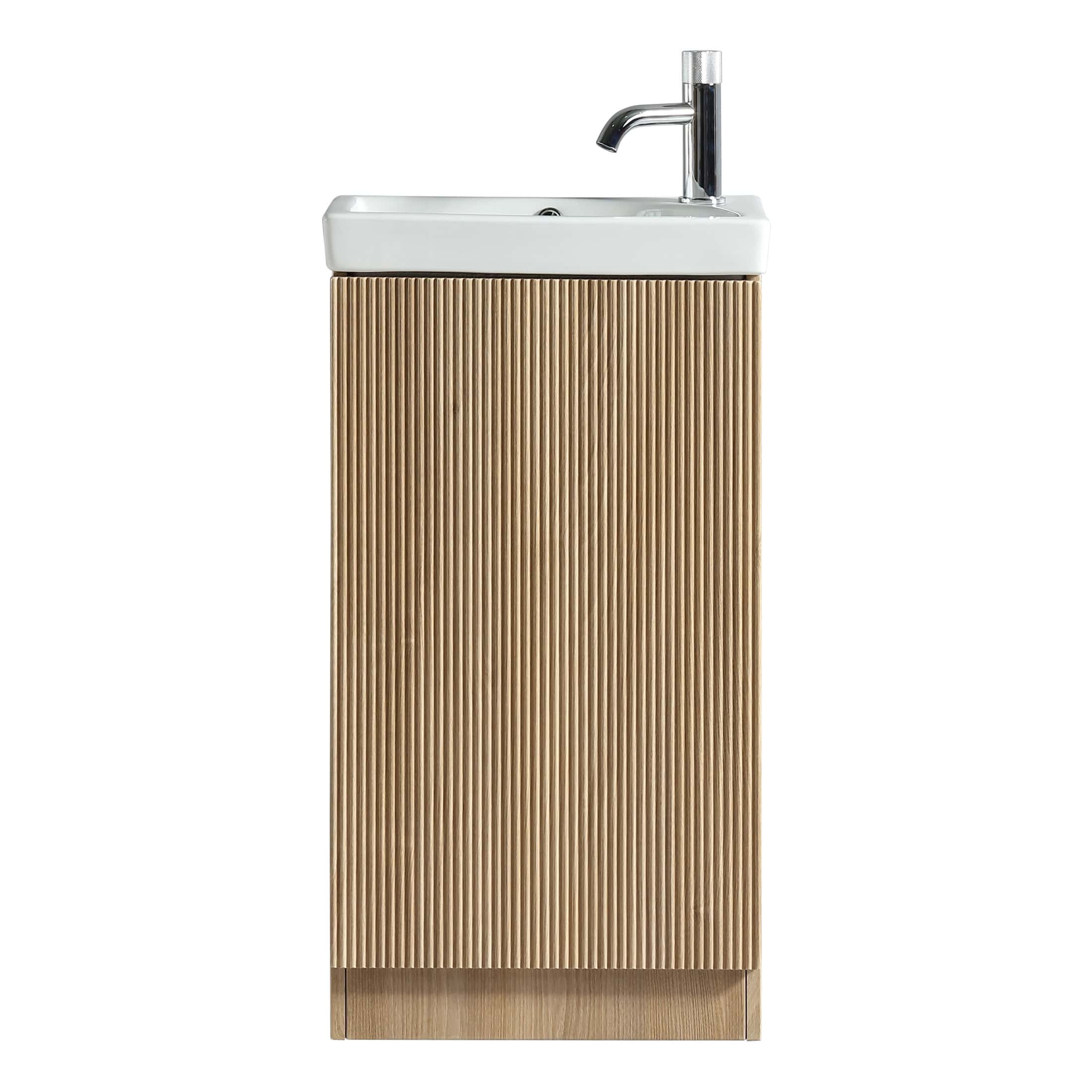 Stylish bathroom vanity unit with integrated ceramic sink and modern chrome tap, featuring a wood-textured ribbed front for contemporary bathroom decor.