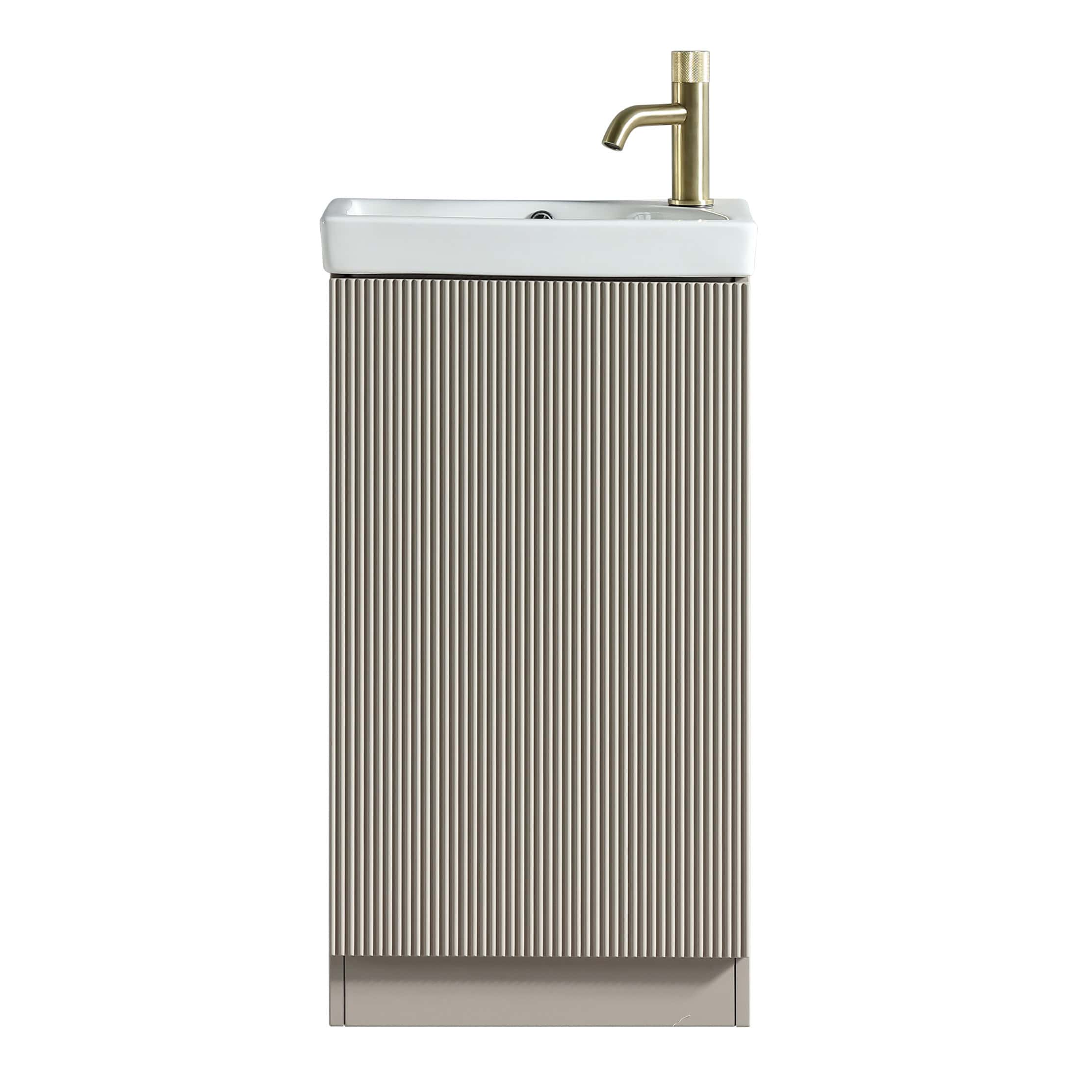Sleek bathroom vanity with a ribbed beige cabinet and a white ceramic sink featuring a brass faucet, perfect for modern and contemporary bathroom designs.