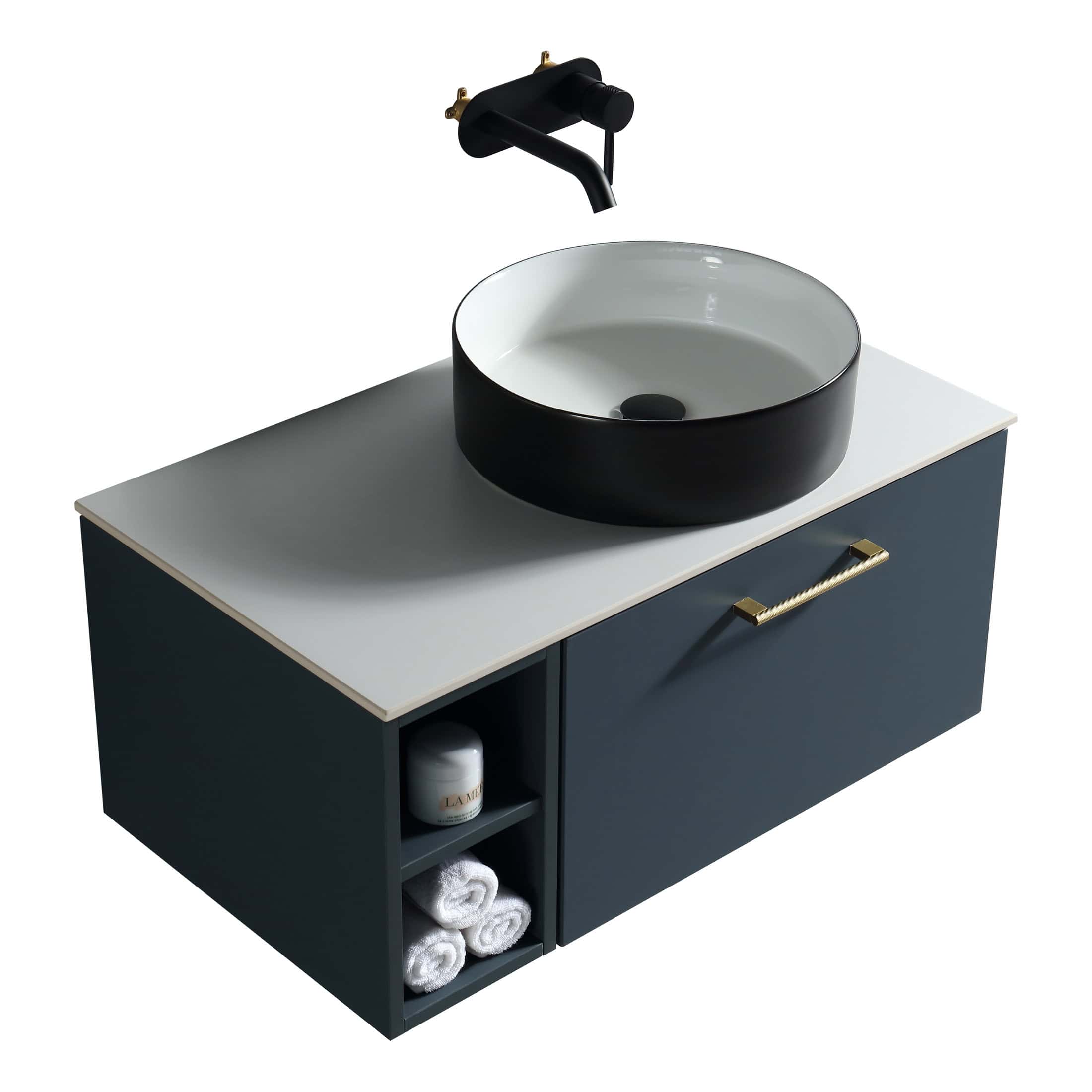 Sleek modern bathroom vanity with round vessel sink, black tap, navy blue cabinet with gold handle, and storage shelves for towels and toiletries, perfect for contemporary bathroom design.