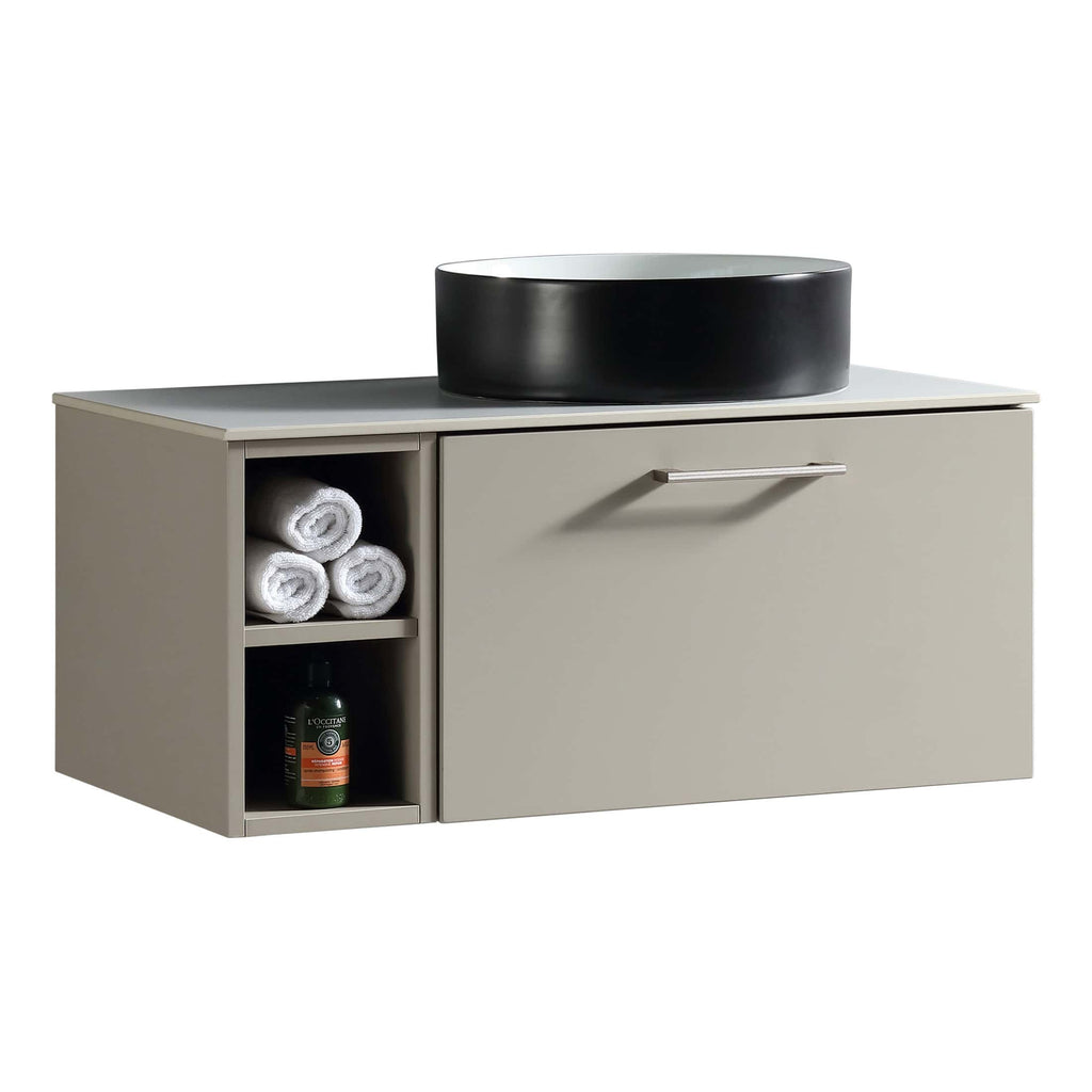 Elegant beige bathroom vanity with open shelf for towels and storage space, topped with a modern black vessel sink, ideal for contemporary bathroom decor and organisation.
