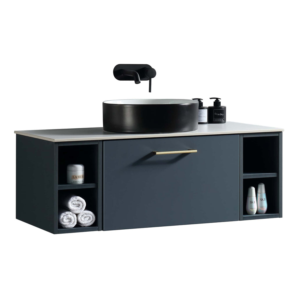 Sleek modern bathroom vanity with black and navy blue cabinetry, white countertop, round vessel sink, and wall-mounted black faucet, featuring storage for toiletries and soft towels.