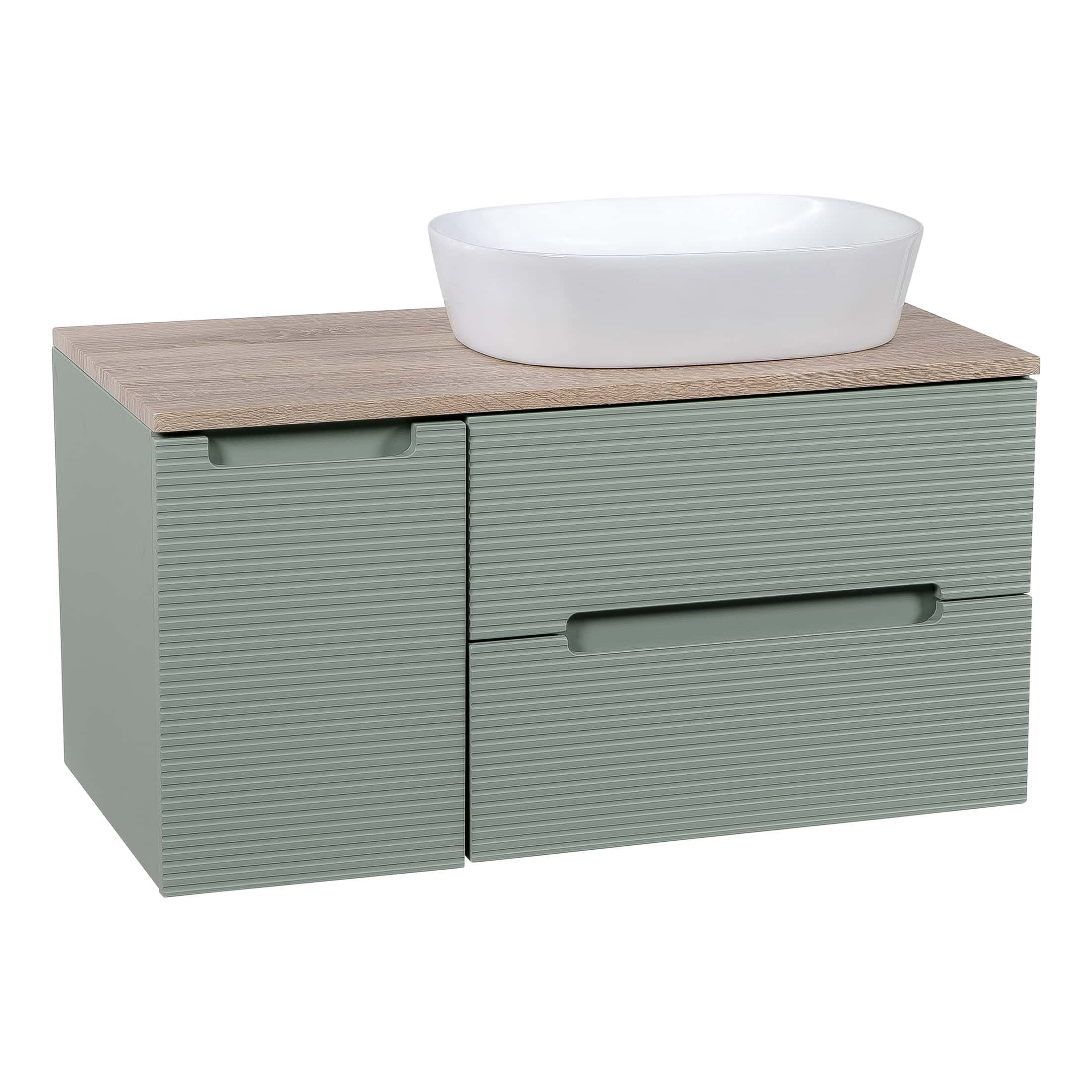 Modern bathroom vanity unit with a ribbed sage green finish and a wooden countertop, featuring a white countertop basin, ideal for contemporary bathroom refurbishment and storage solutions.