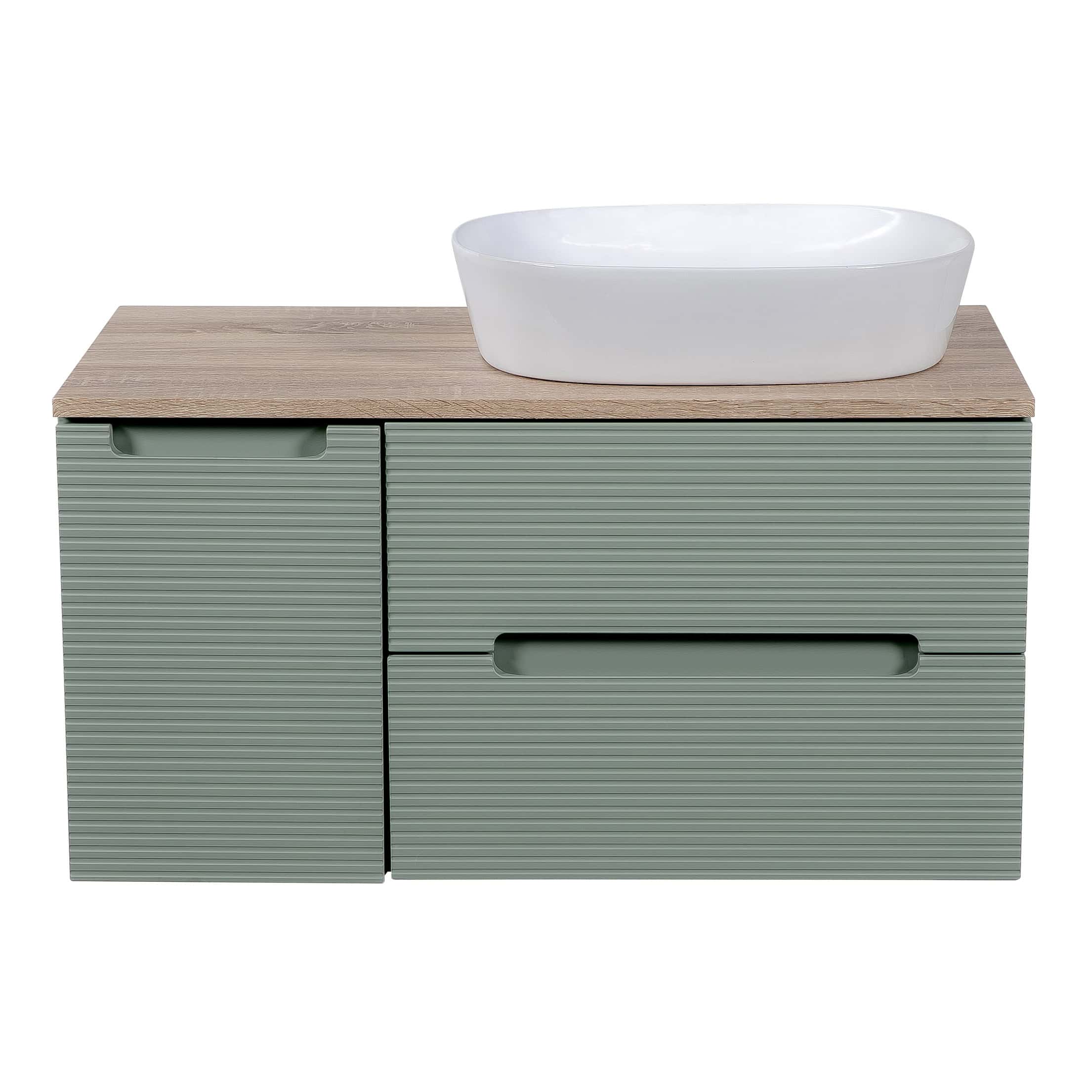 Contemporary bathroom vanity unit with a minimalist design, featuring a wooden top, sage green textured drawers, and a sleek white vessel sink, ideal for modern bathroom interiors.