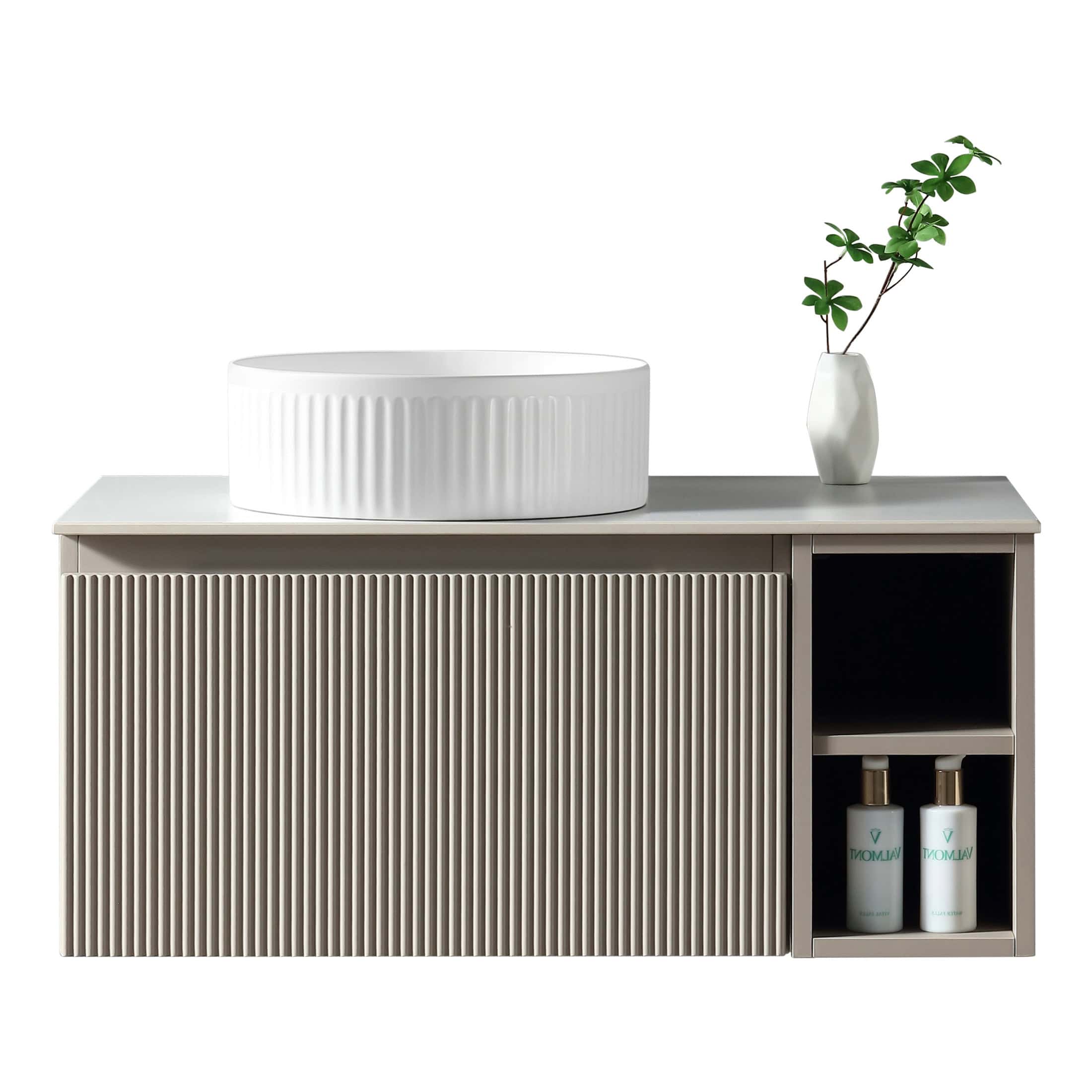 Elegant bathroom vanity unit with a stylish slatted design, featuring a modern oval white countertop basin and a minimalistic white vase with green foliage for a contemporary look.