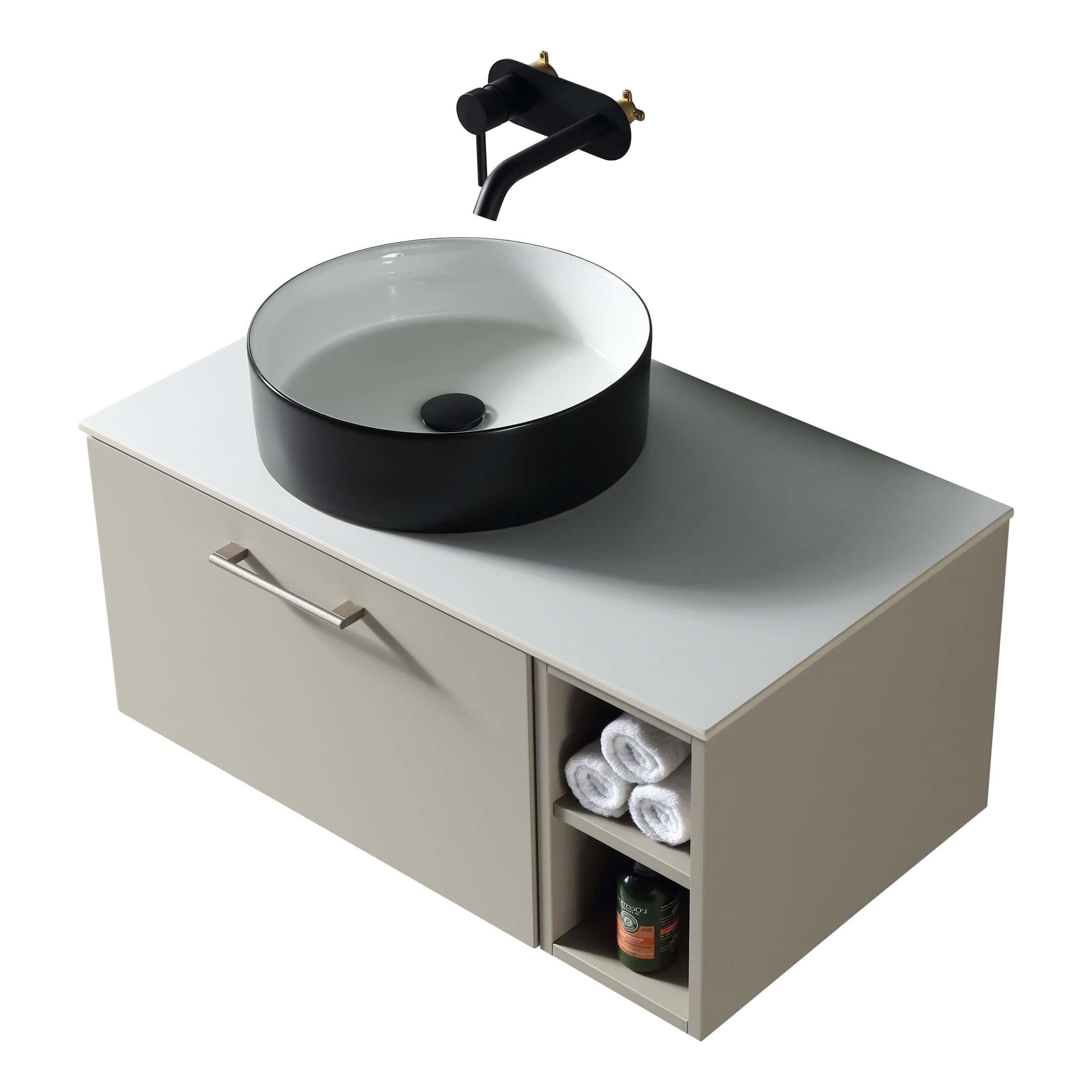 Modern ceramic bathroom sink with a sleek black and white design on a contemporary vanity unit, ideal for stylish and functional bathroom spaces.